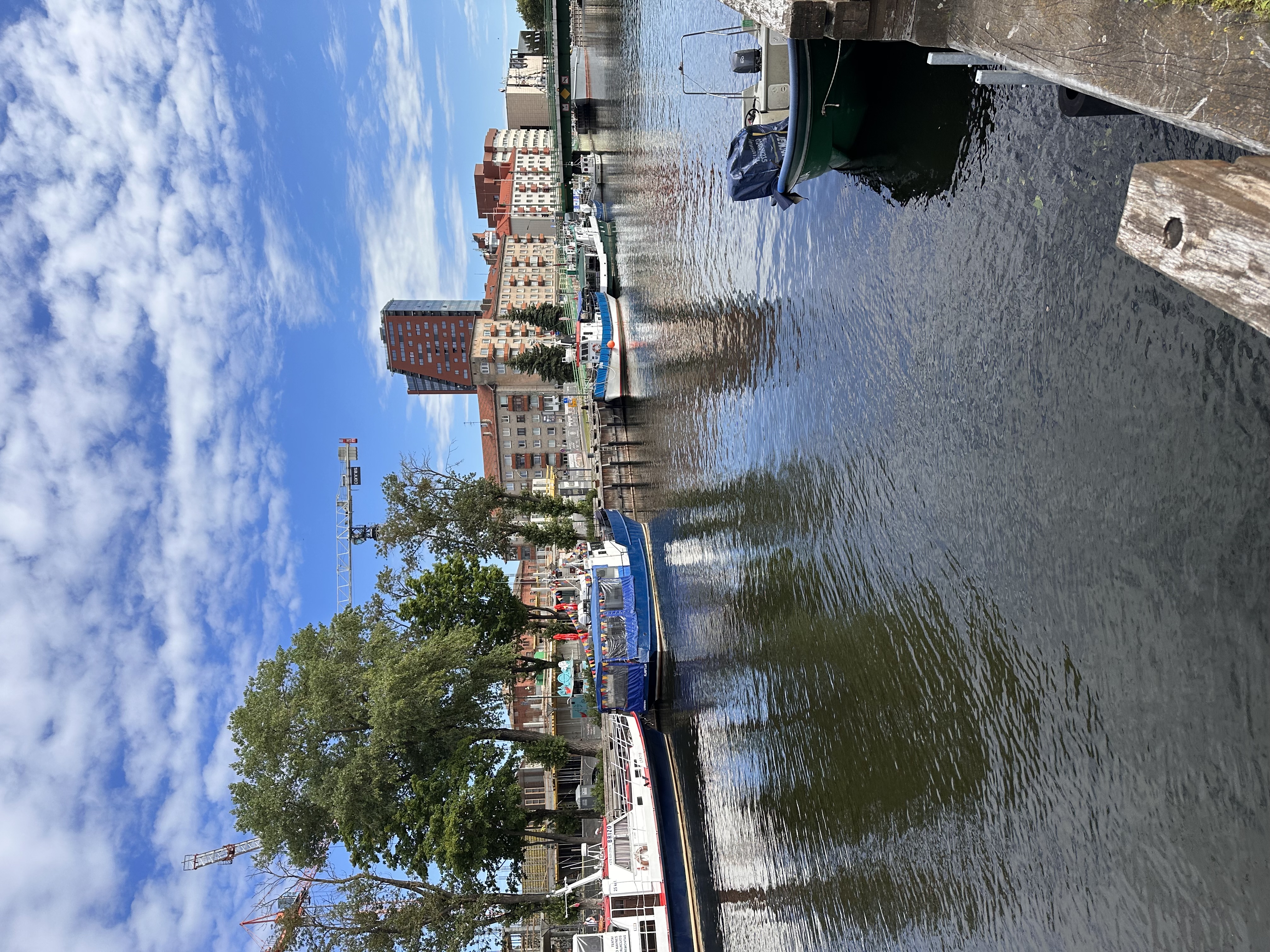 Boats docked along the riverfront harbor of Klaipėda