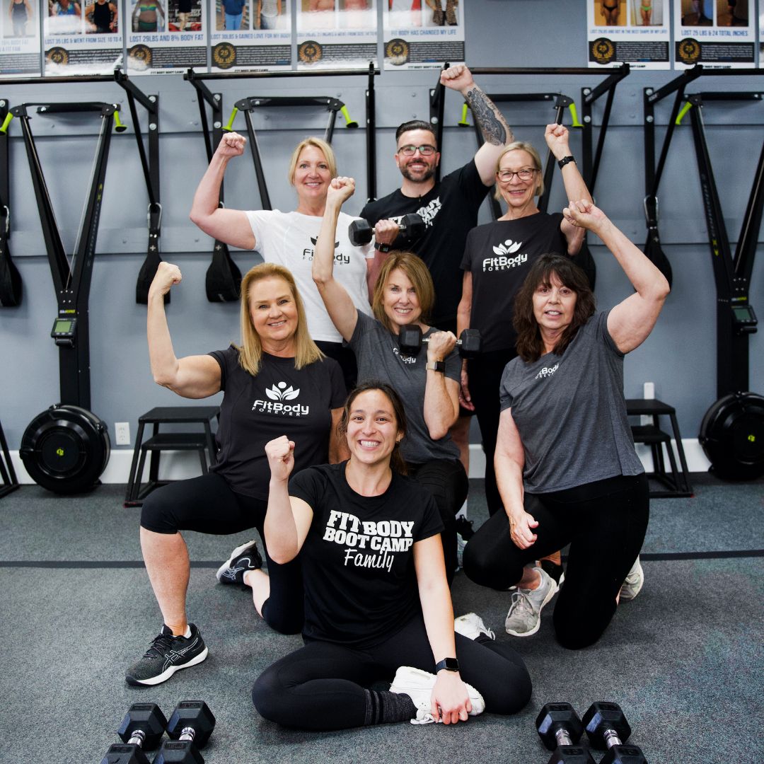 Fit Body Forever community members and coaches celebrating in Moore gym