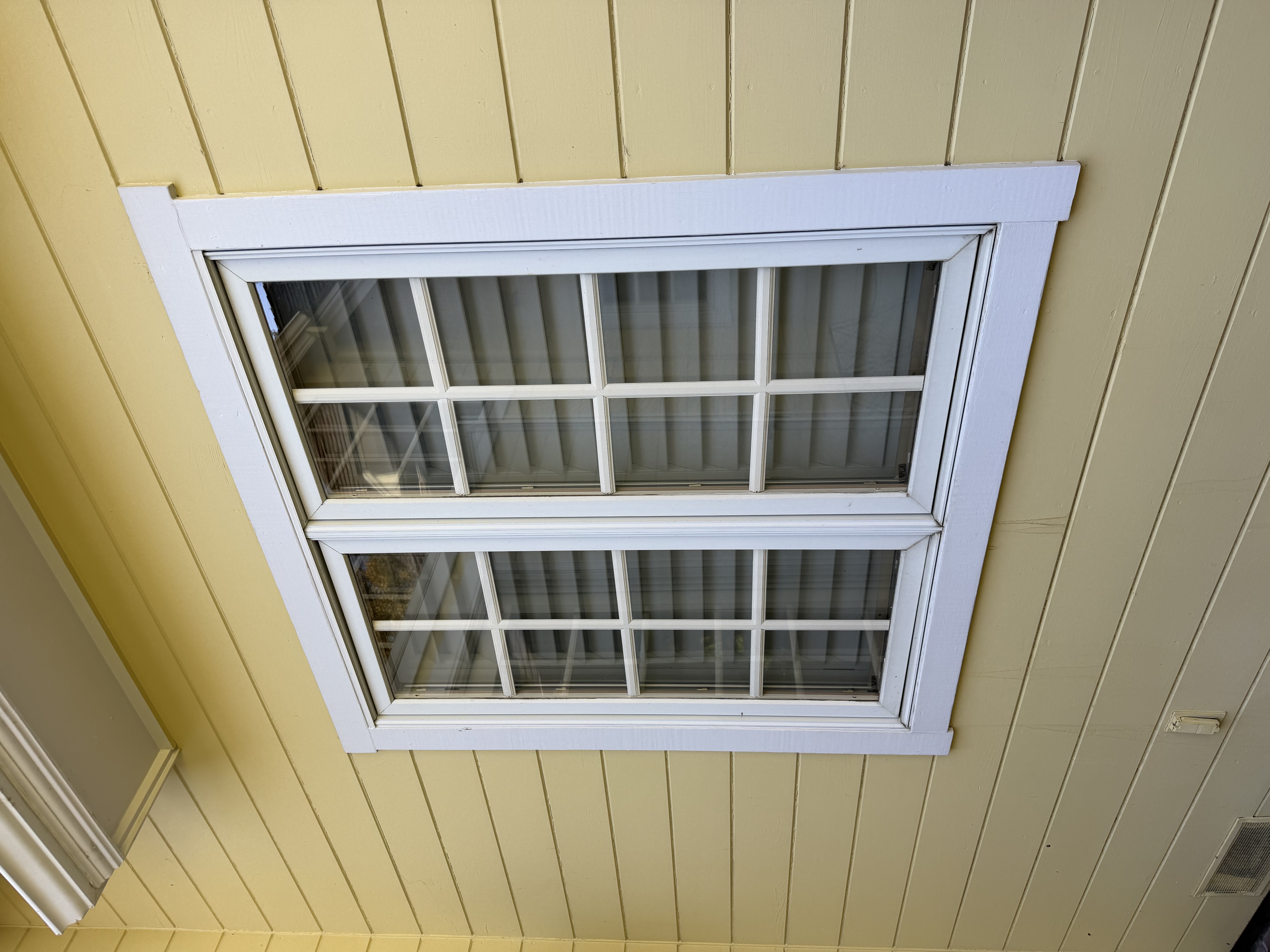 Clean exterior window panes on an Atherton home after washing by the Scrubs team