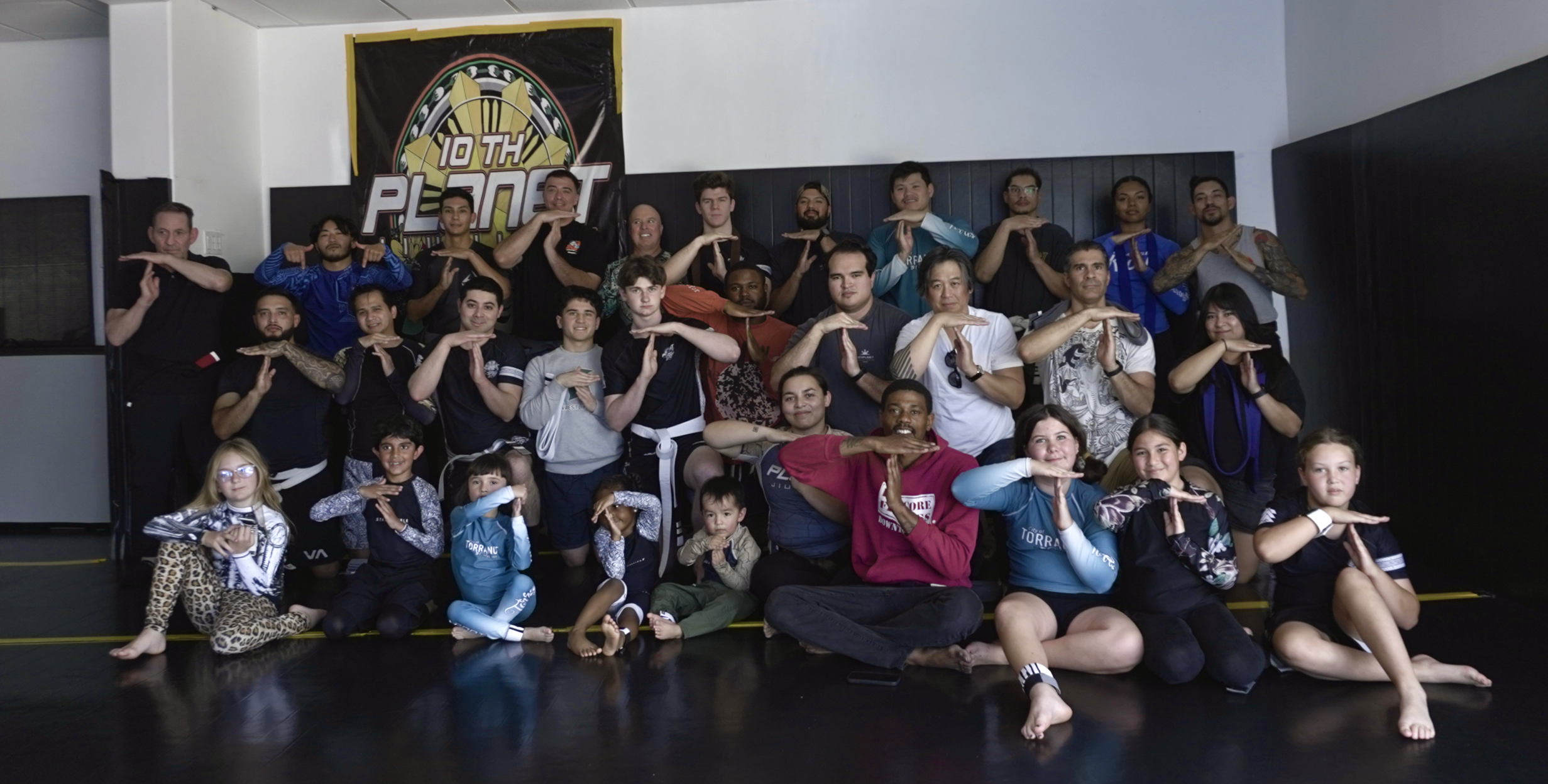 10th Planet Torrance team belt promotions group photo on the mat