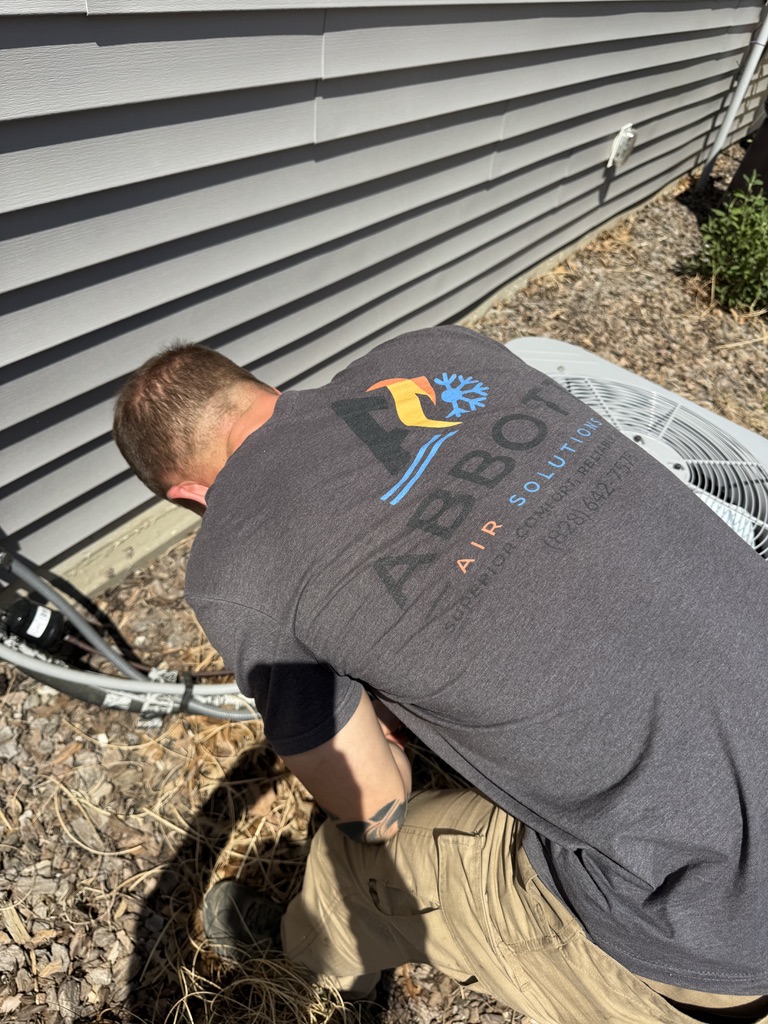 Mike Abbott evaluating and diagnosing HVAC heating equipment