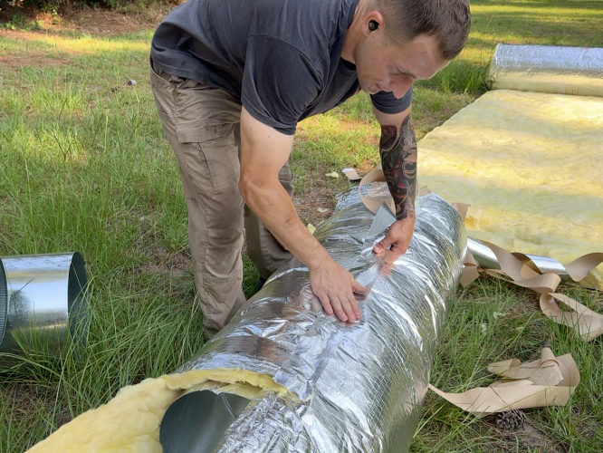 Mike Abbott evaluating and preparing residential ductwork