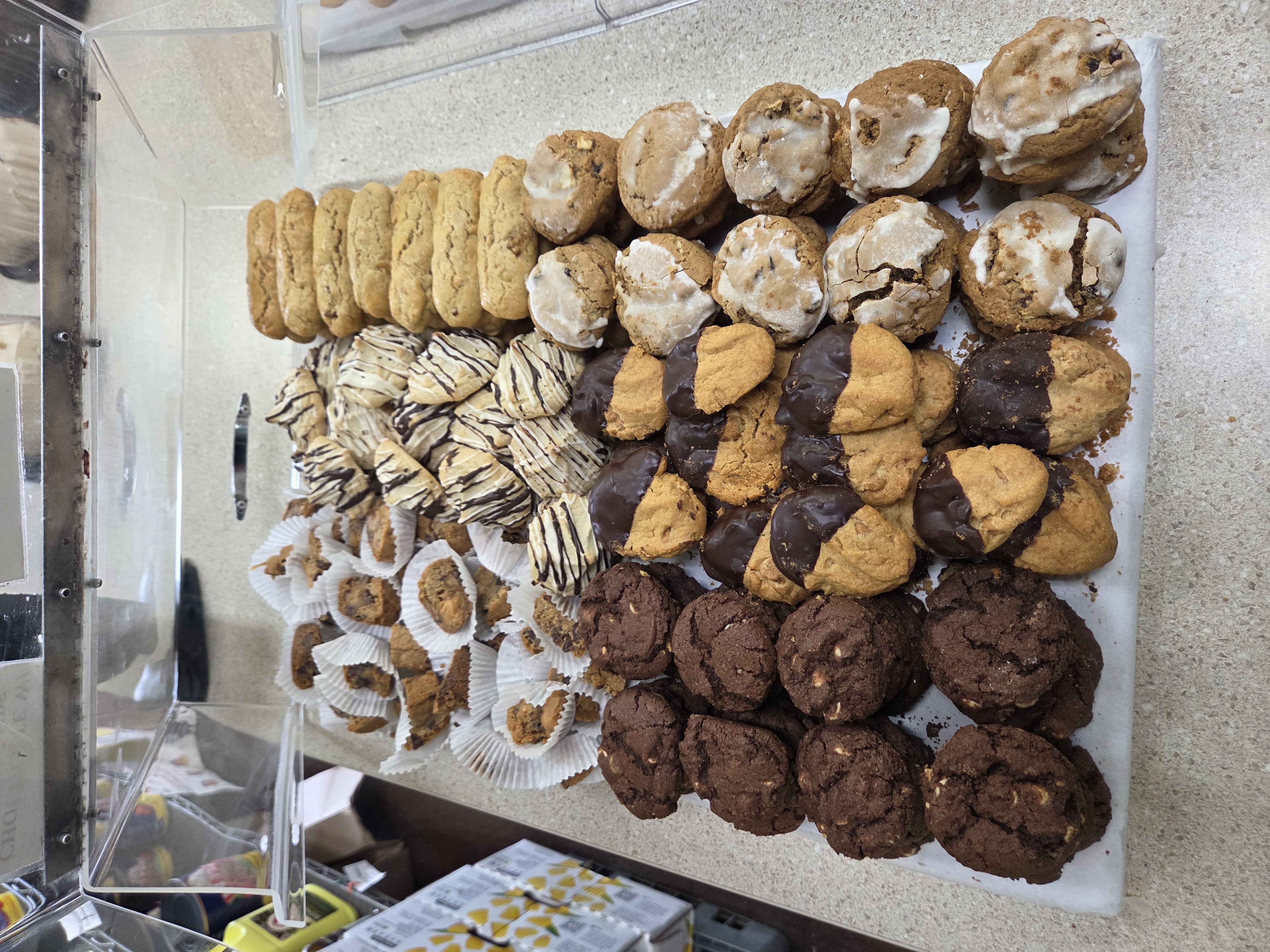 Fresh chocolate-dipped and glazed cookies assortment at Sap's