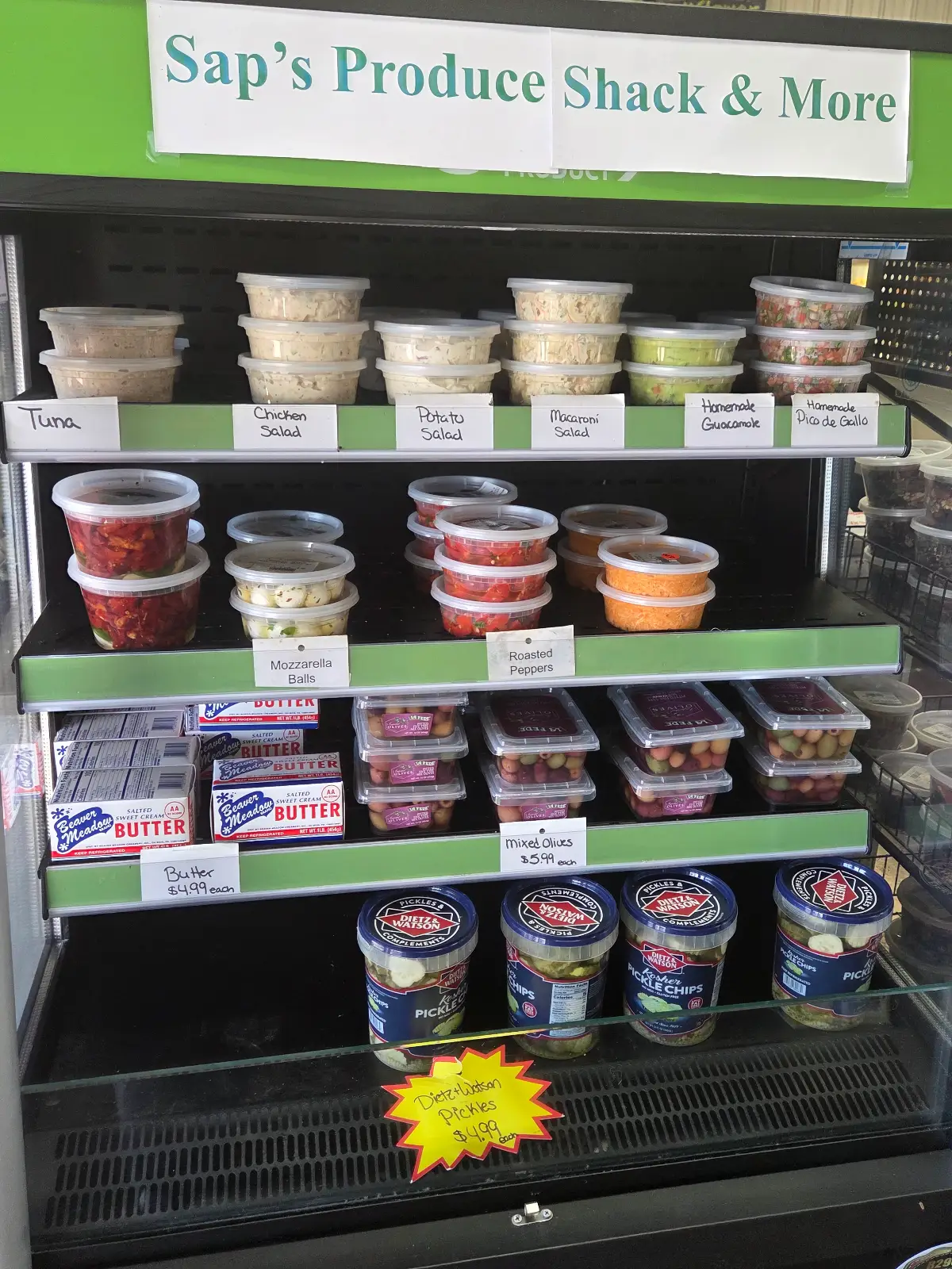 Prepared deli salads, homemade dips, pickles, and cooler essentials at Sap's