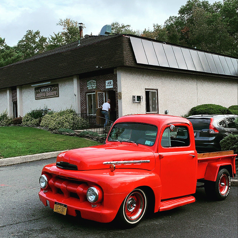 Classic red Ford pickup truck outside Greg Zurla's Auto Body shop in Congers, NY