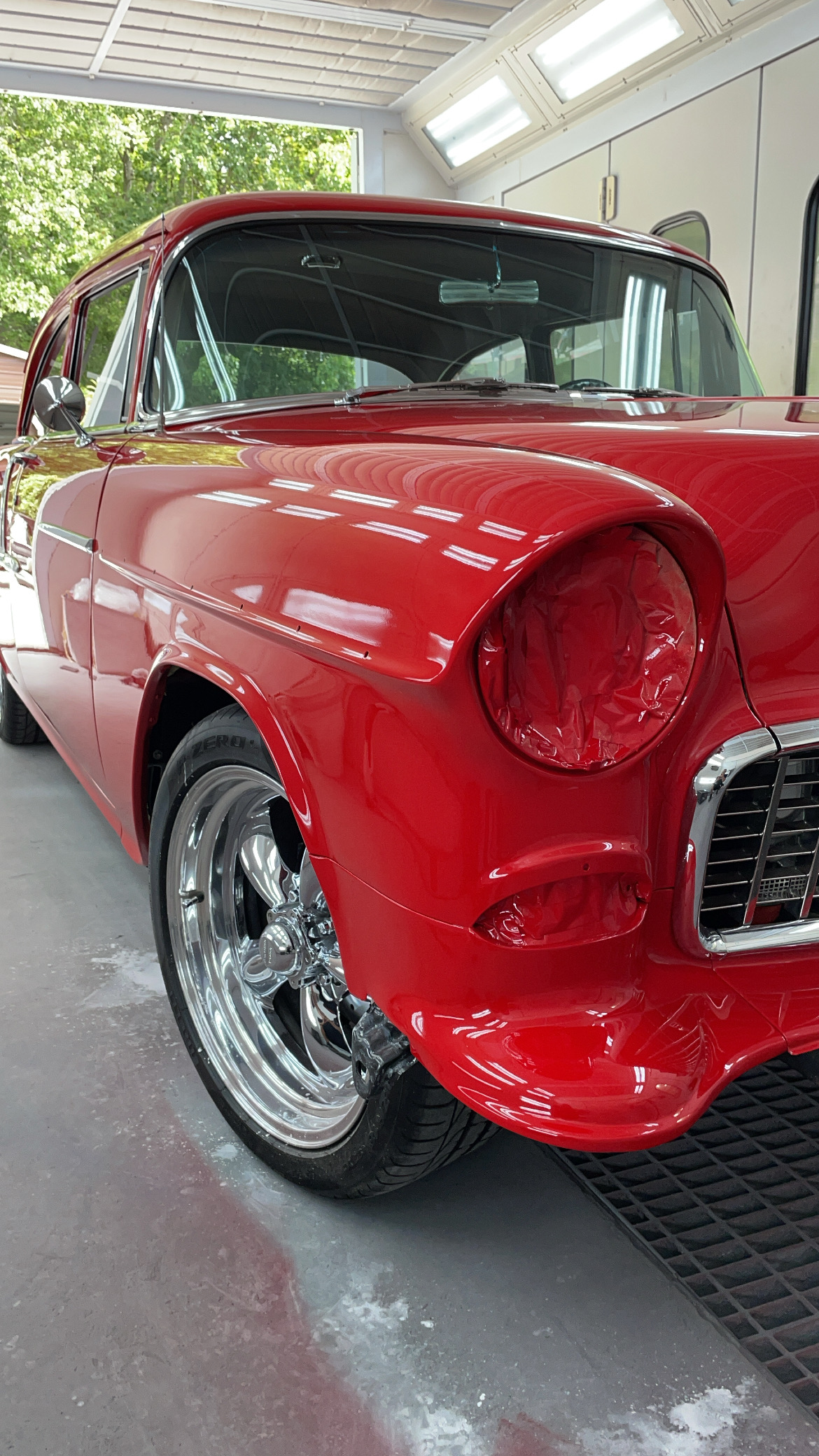 Vintage red Chevrolet high-gloss spray finish in the paint booth at Greg Zurla's Auto Body, Congers, NY
