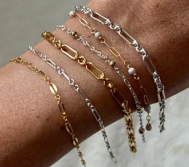 Permanent gold bracelet stack on wrist