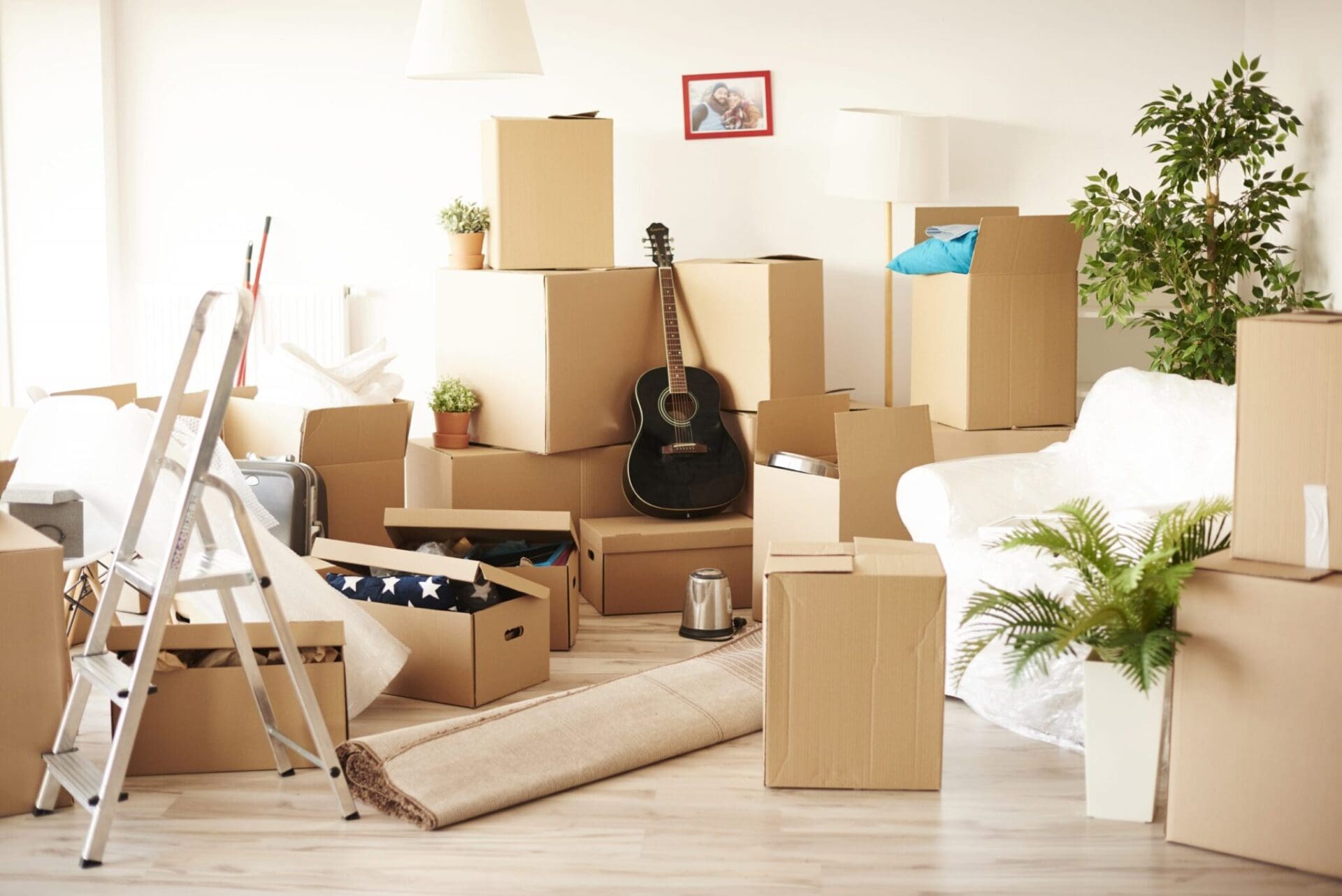 top-view-messy-full-moving-boxes-room-scaled