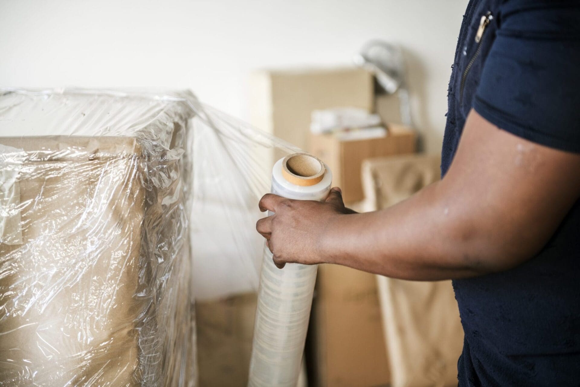 black-man-moving-furniture-scaled