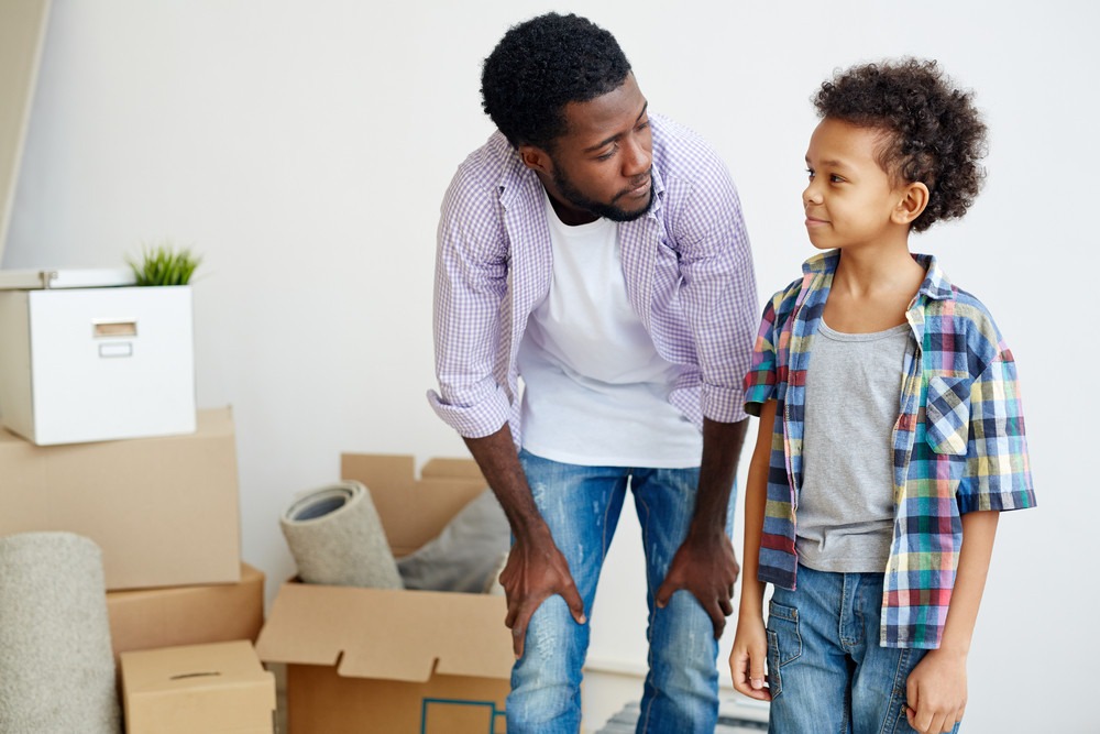 storyblocks-young-father-and-son-talking-in-their-new-flat-or-house_rIHPbLvCb_PMNW