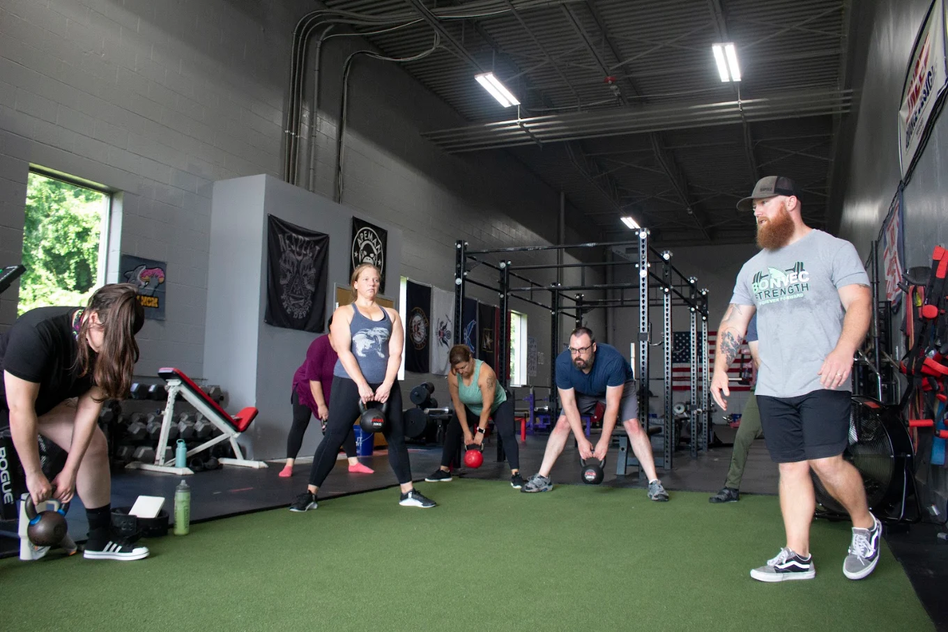 Coached kettlebell workout with members training at Bonvec Strength