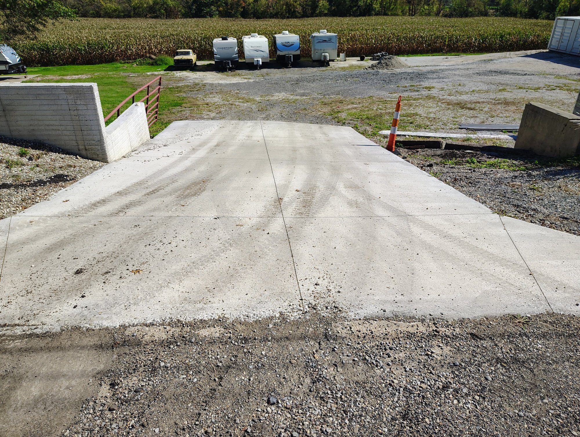 Newer concrete entrance apron at Ragersville Storage leading from Ragersville Road into the gravel storage area