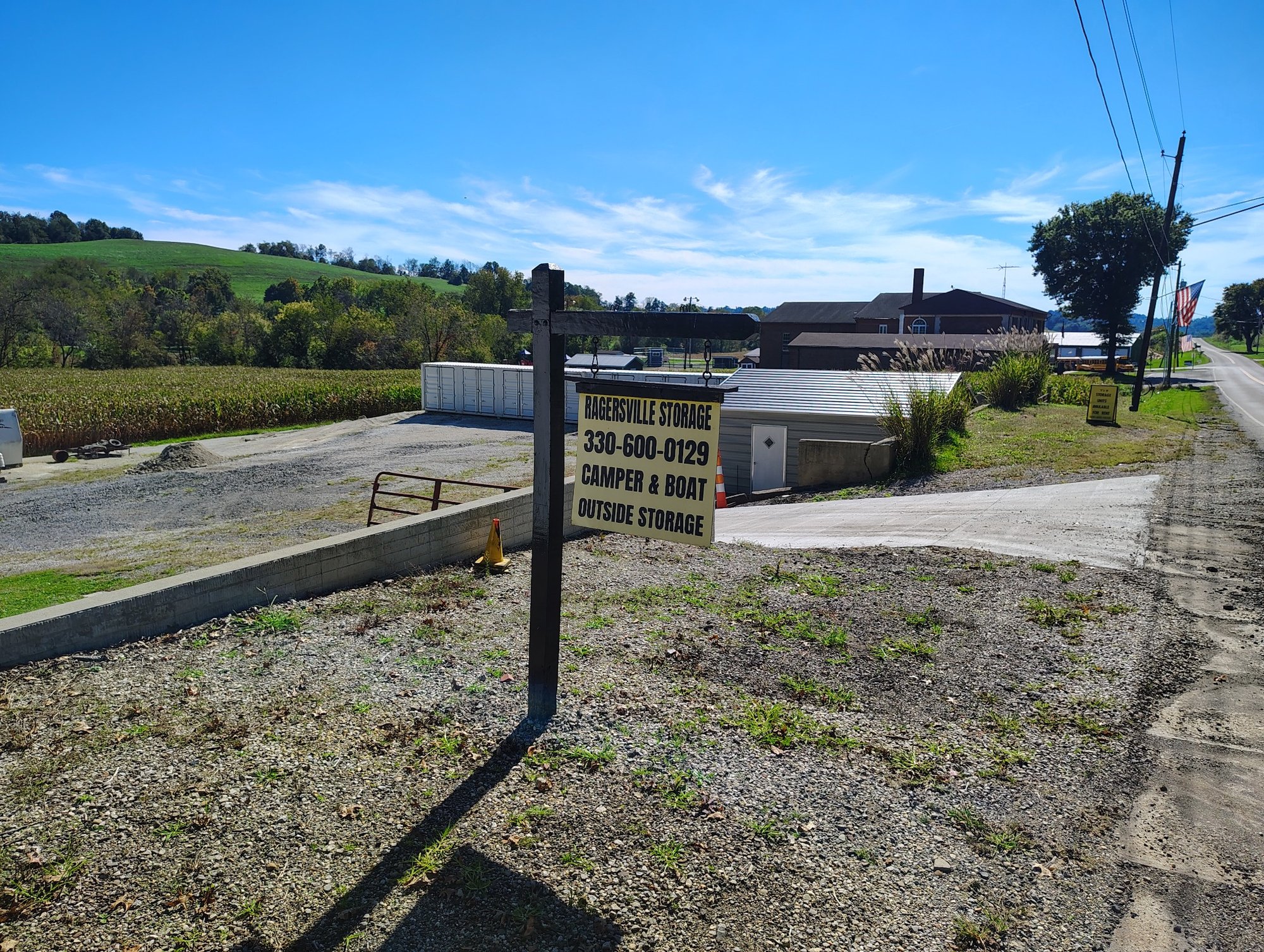 Front streetview of Ragersville Storage LLC with roadside sign and storage units in rural Sugarcreek, Ohio
