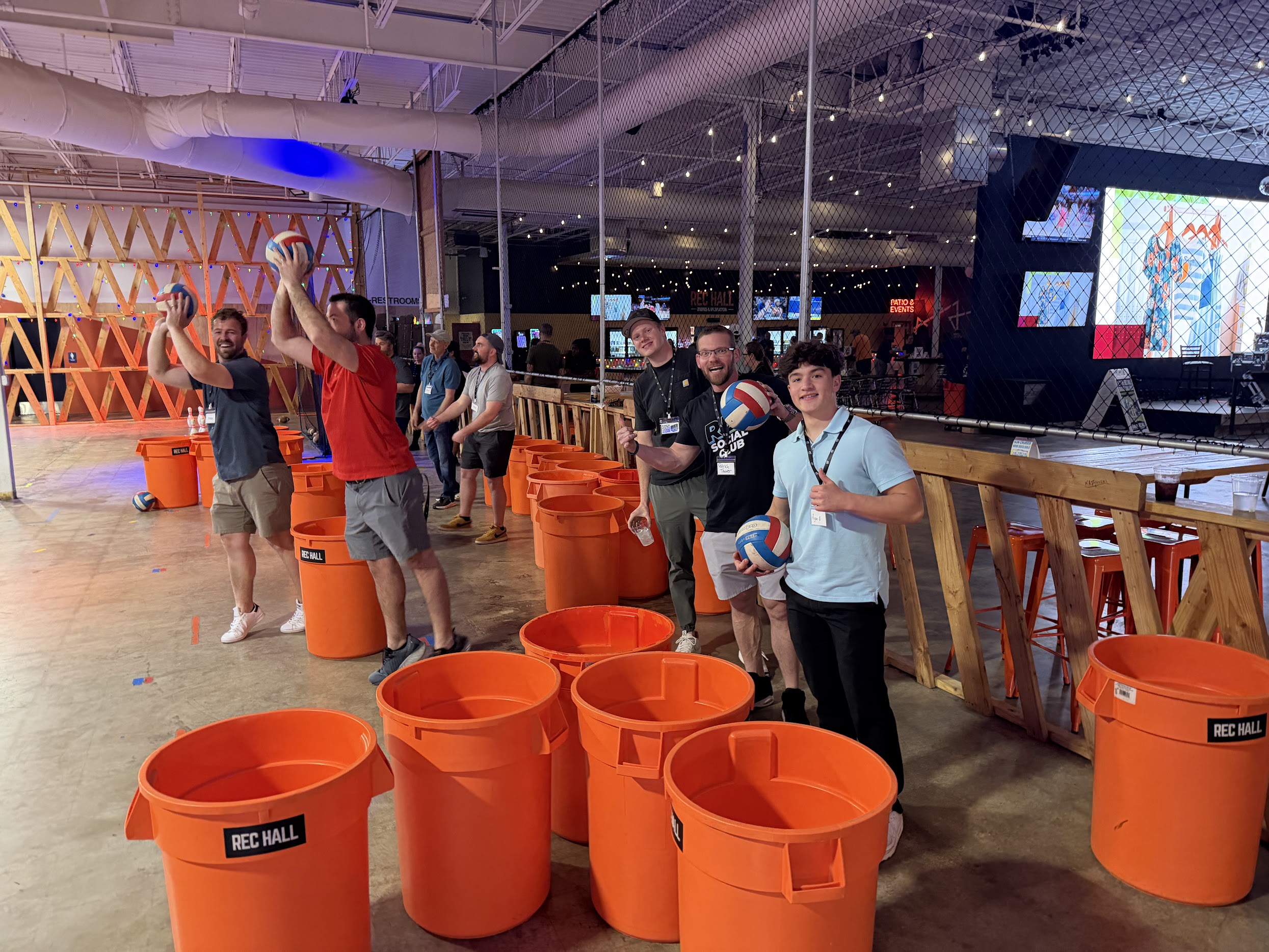REI Social Club members playing giant pong games at Rec Hall