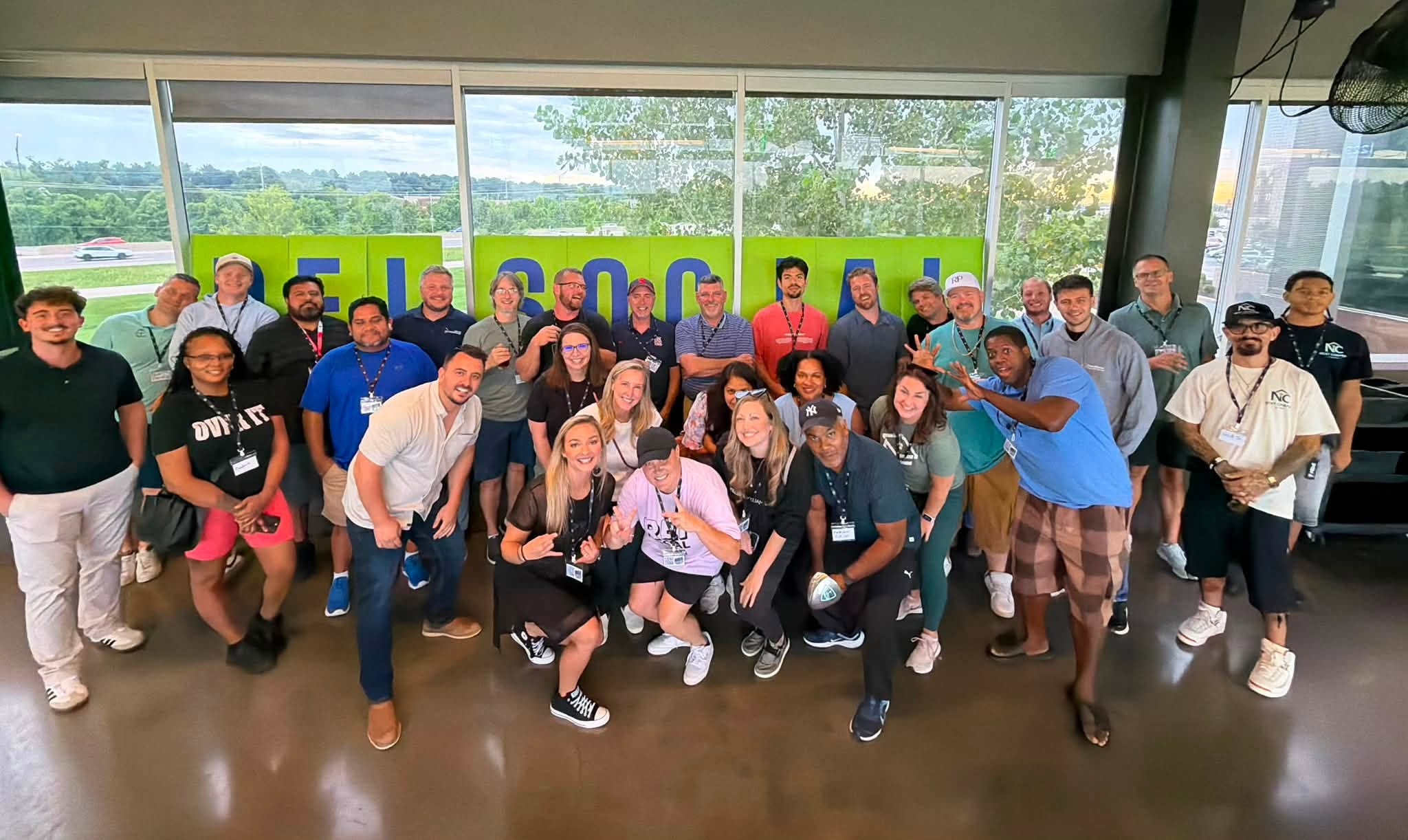 Group of real estate investors smiling at an REI Social Club event