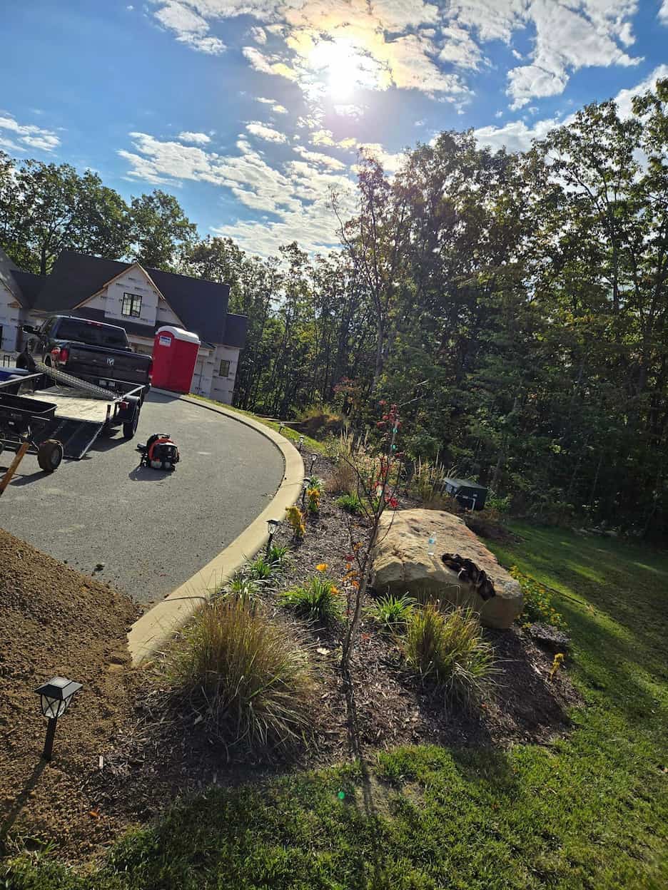 Custom landscaping installation with fresh mulch and plantings in Chattanooga