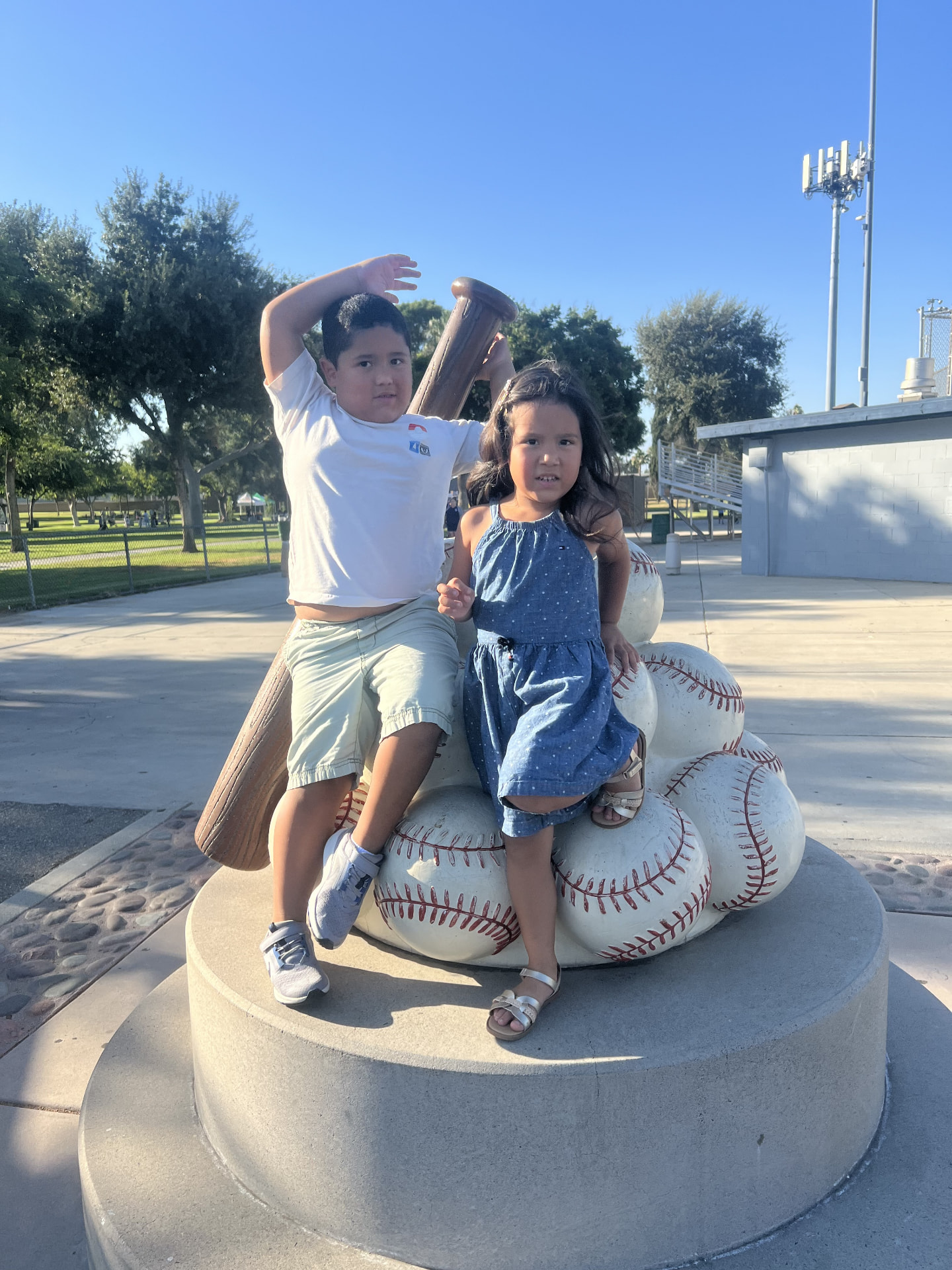 Dan Jenkins and family by a sculpture