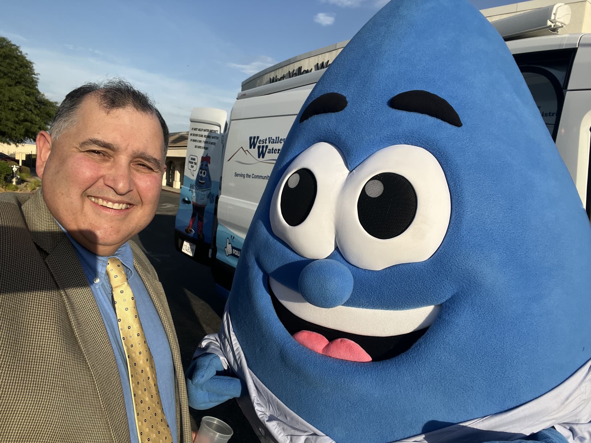 Water drop mascot at a community outreach event