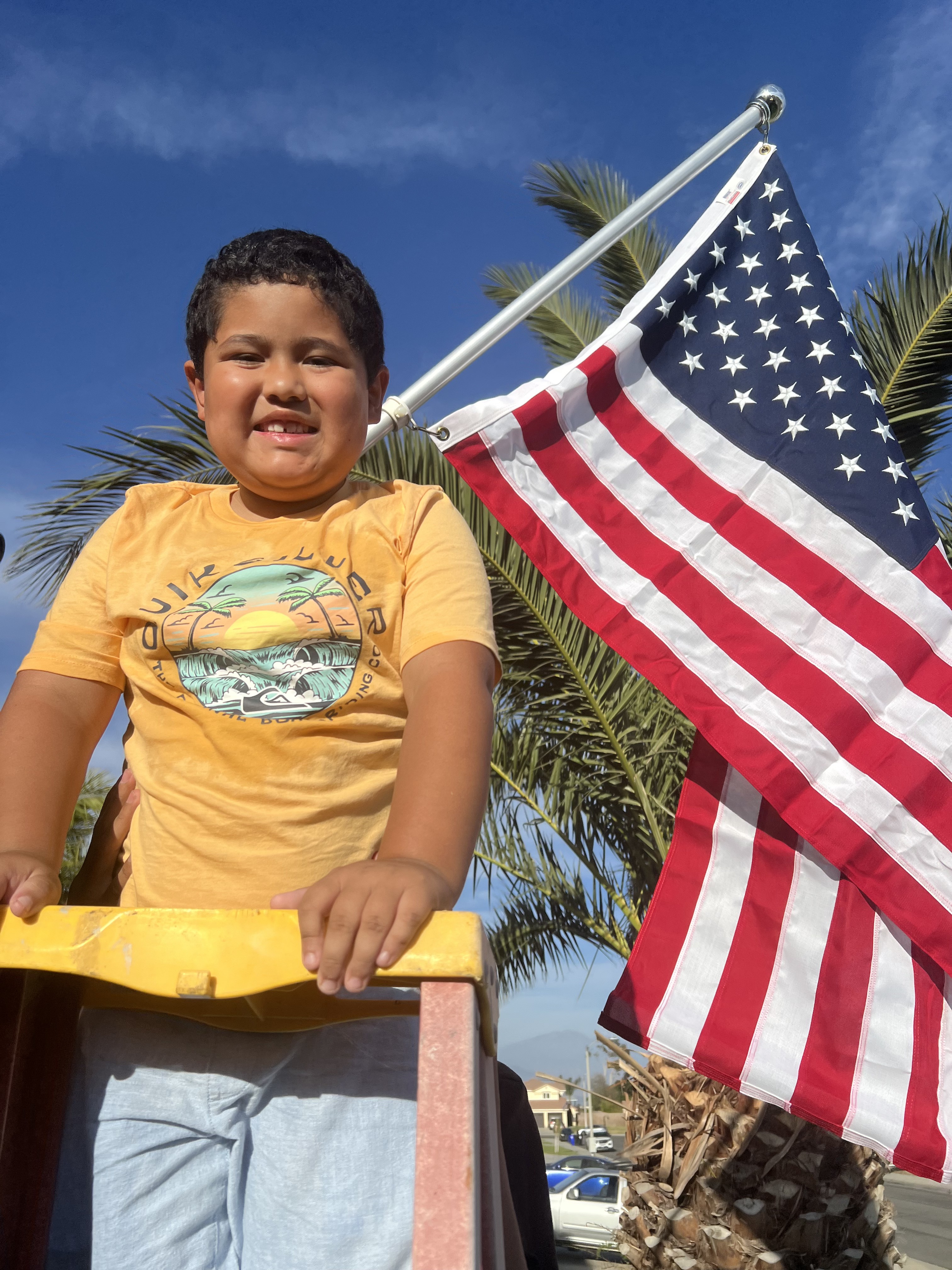 Family member smiling with American flag