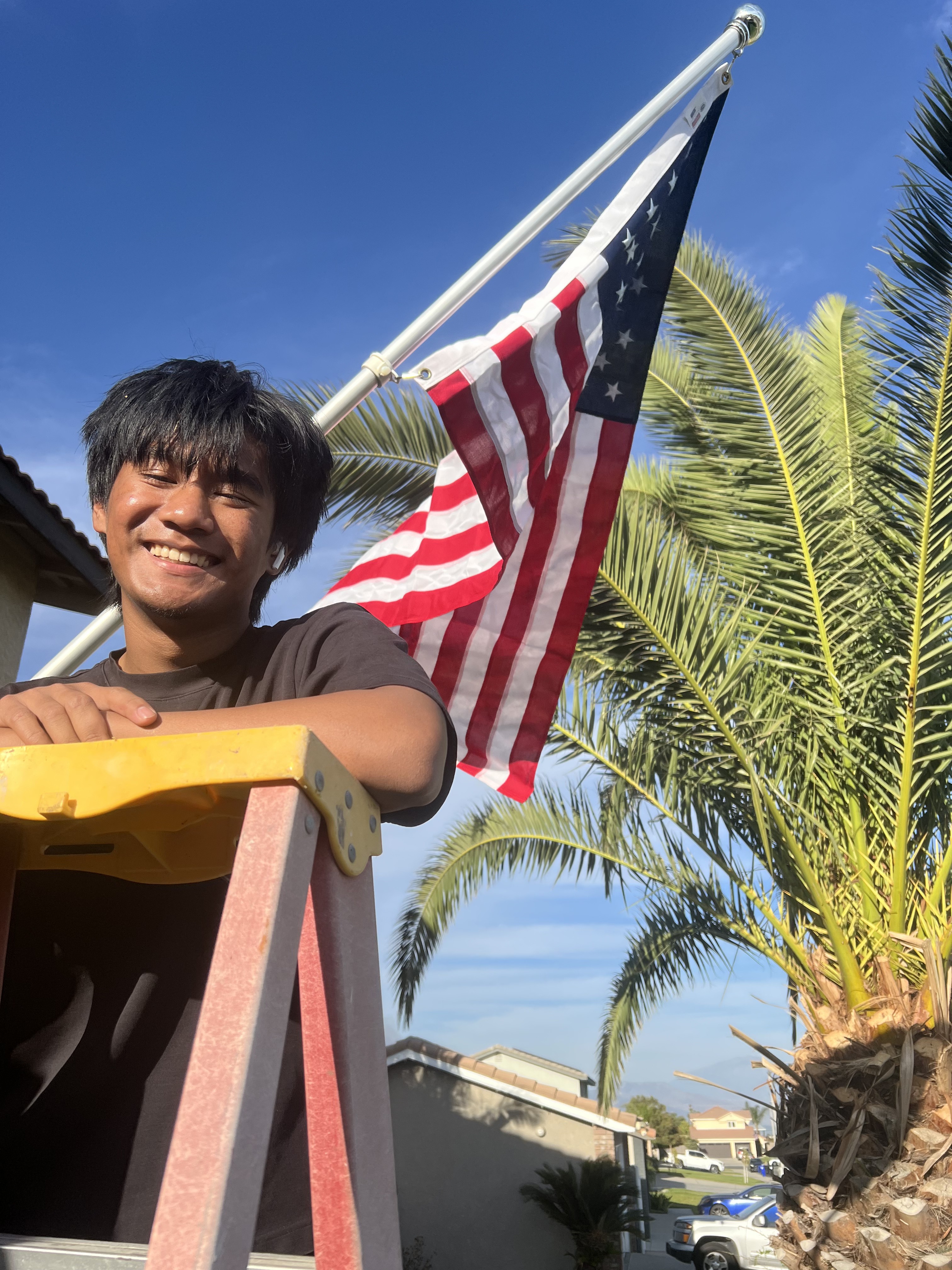 Family member smiling with American flag