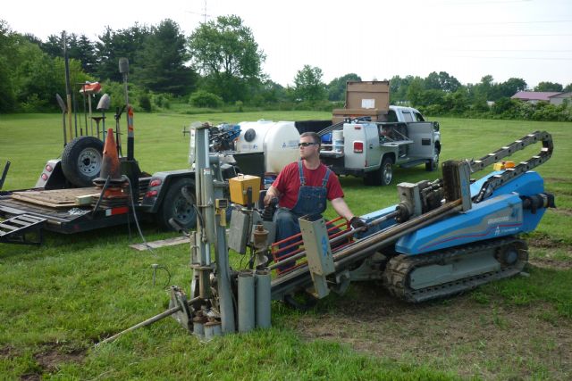 A&P Directional Drilling crew operating directional boring rig on site