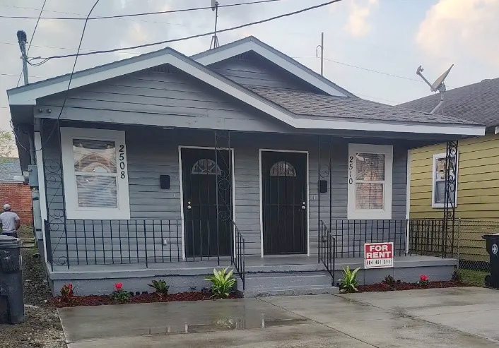Exterior photograph of 2508–2510 Annette Street newly renovated duplex with covered front porch and concrete driveway