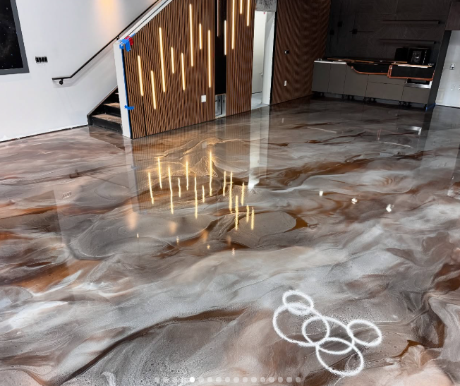 Metallic epoxy floor installation with glossy marble finish
