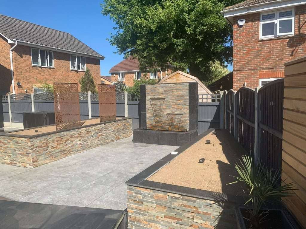 Decorative laser-cut metal screens mounted on grey porcelain patio in Billericay