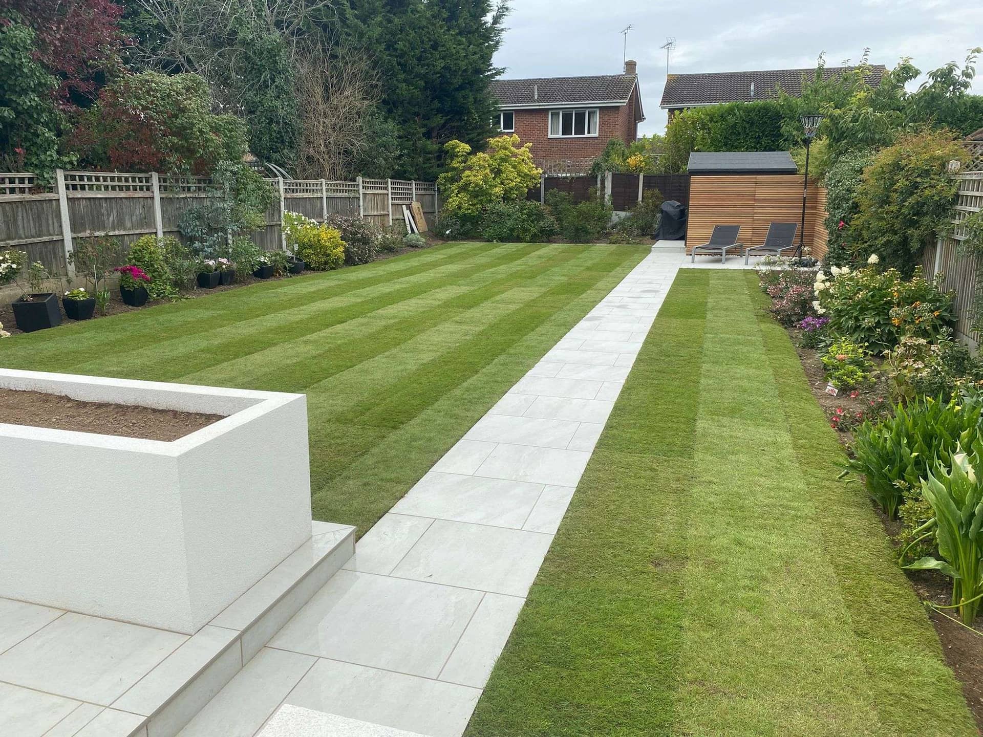 Newly laid lawn and porcelain paving pathway in Hadleigh Essex