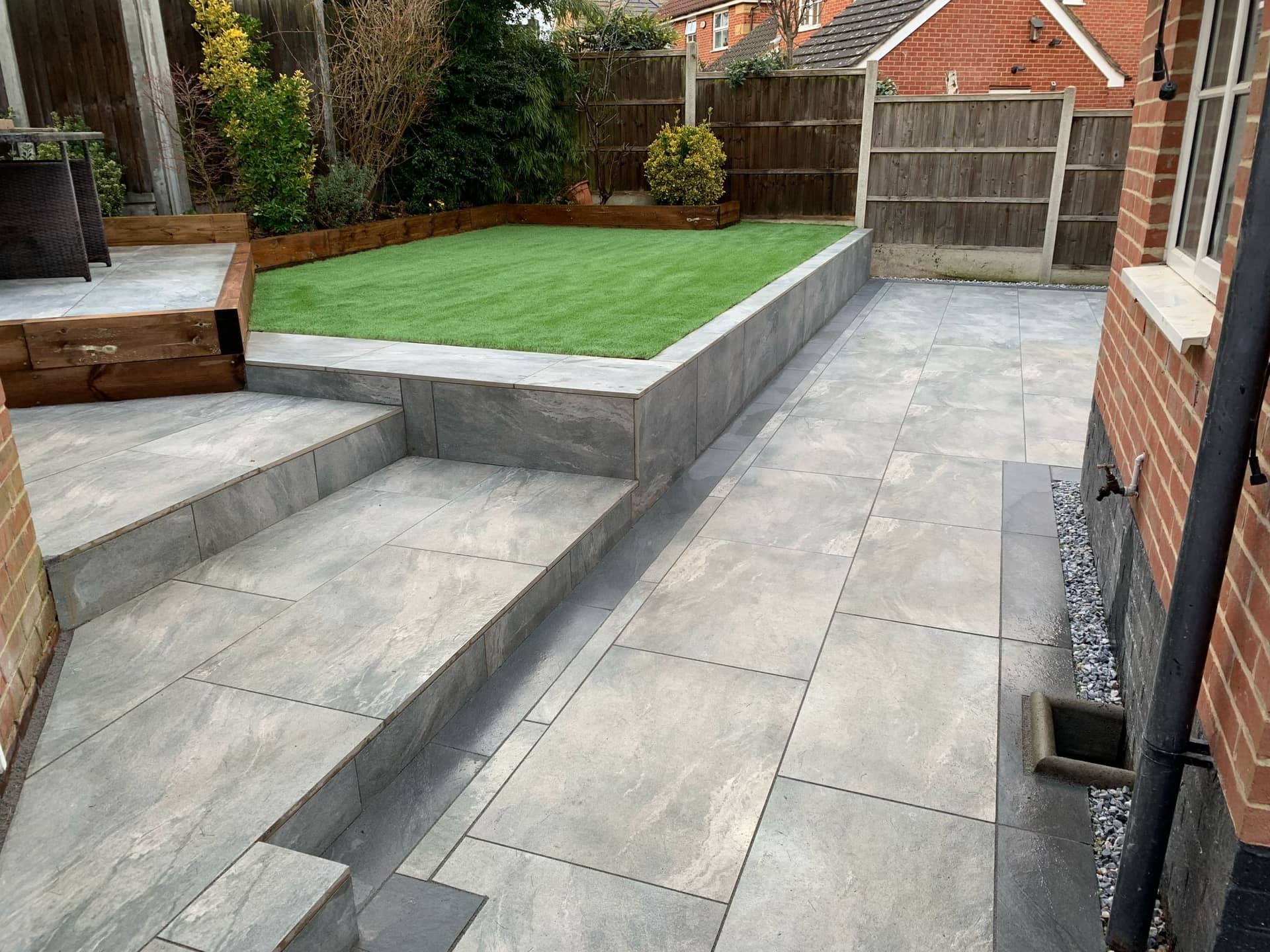Porcelain stepped access between garden tiers faced with matching porcelain tiles