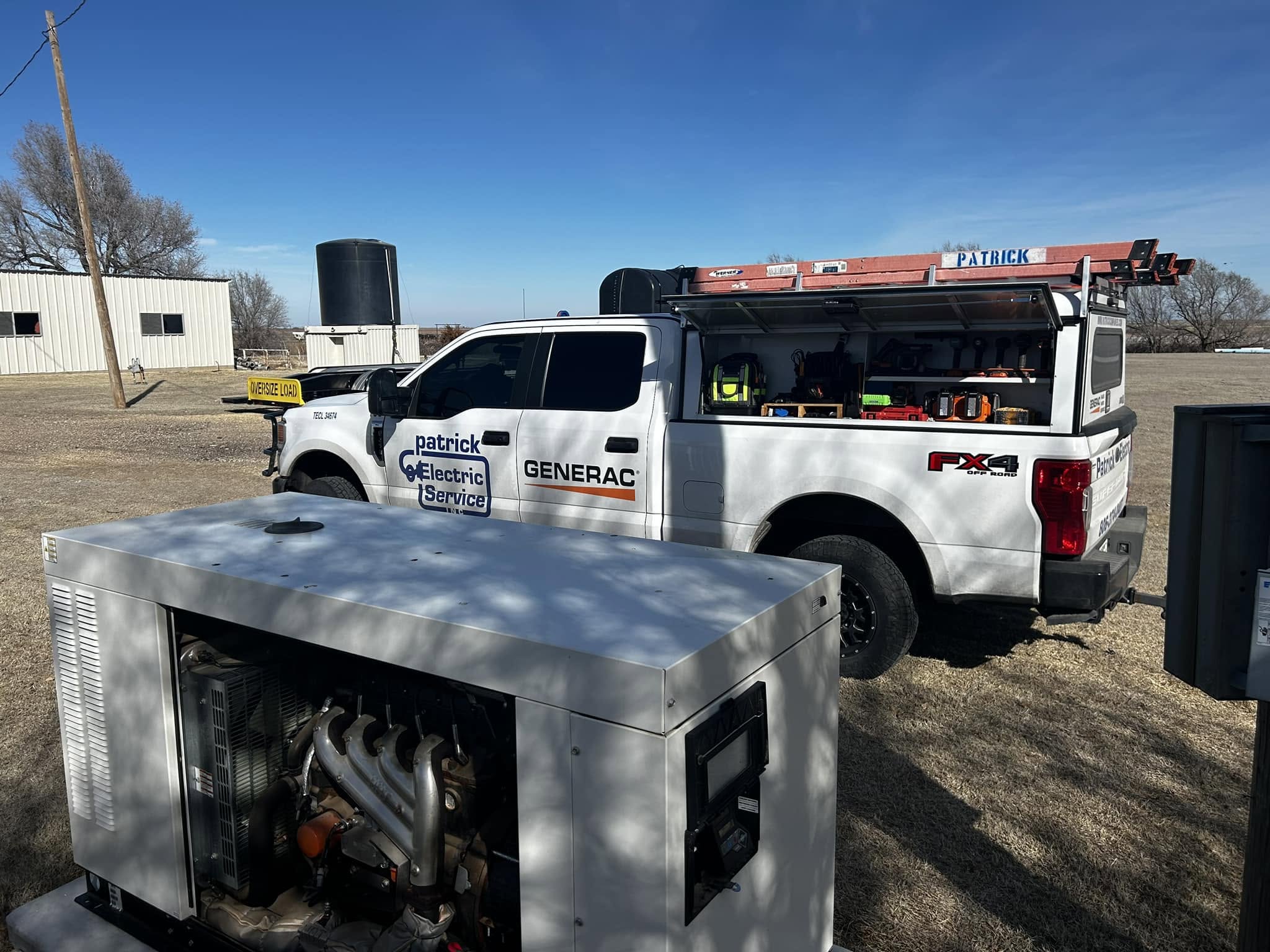 Patrick Electric Service truck parked beside a commercial Generac standby generator