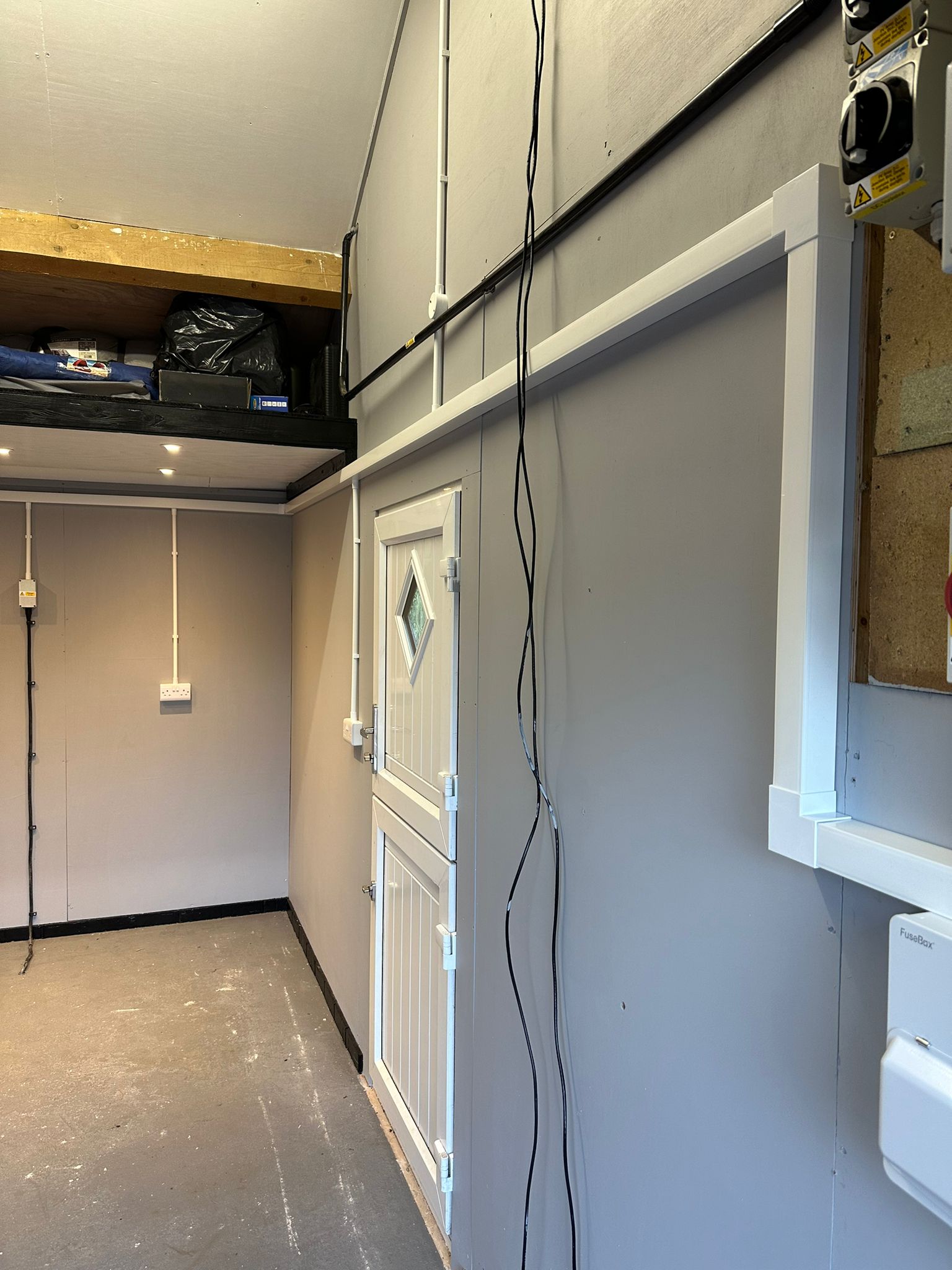 Garage and outbuilding electrical wiring with neat surface-mounted trunking and sub-board by SH Electrical