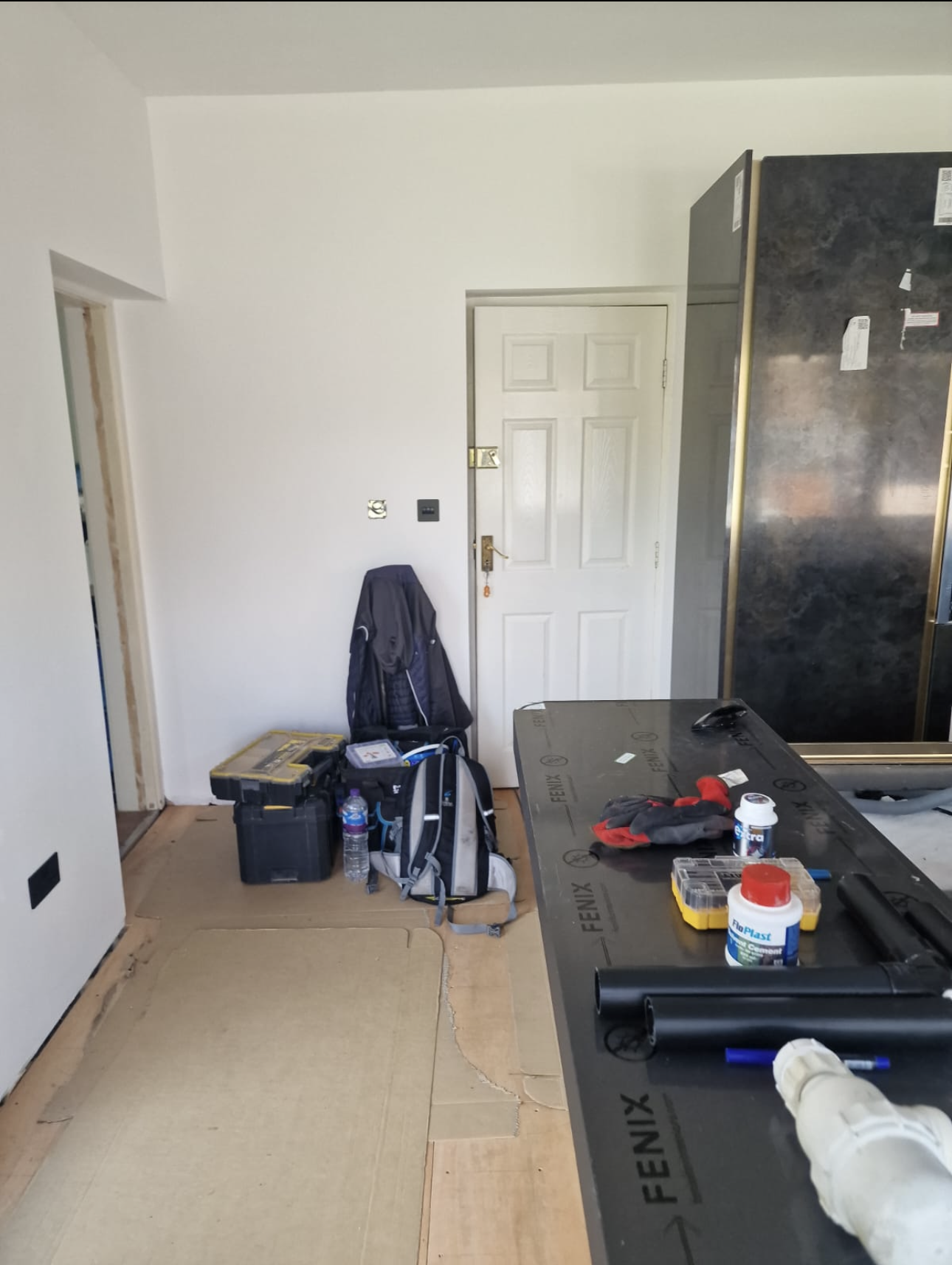 Kitchen extension wiring in progress with wall sockets, switches and island containment runs