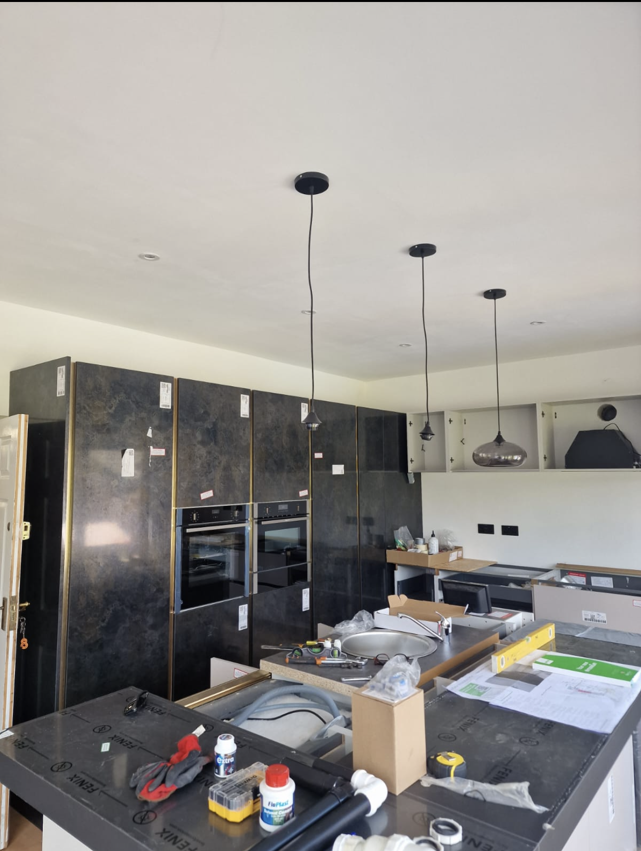 Kitchen renovation second-fix wiring with pendant drops, integrated double ovens and worktop supplies