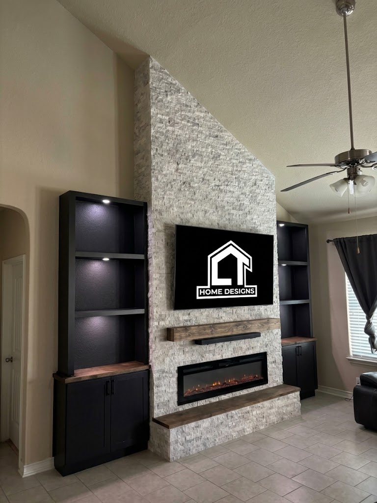 Custom stone fireplace and vaulted media wall with matte black built-in cabinetry and warm wood accents by CT Home Design