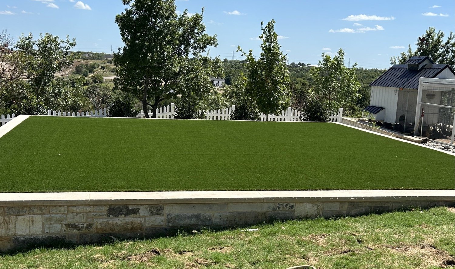 Completed turf area beside a masonry edge
