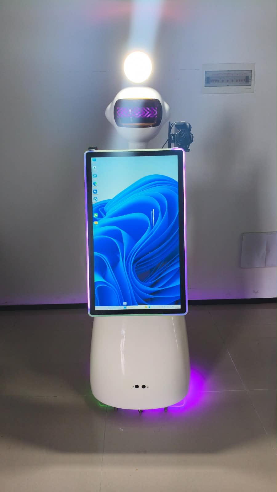 White robot photo booth with interactive screen