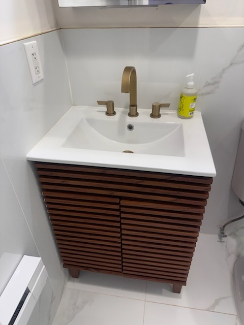 Modern Wood Slat Vanity & Brass Faucet Sanitization