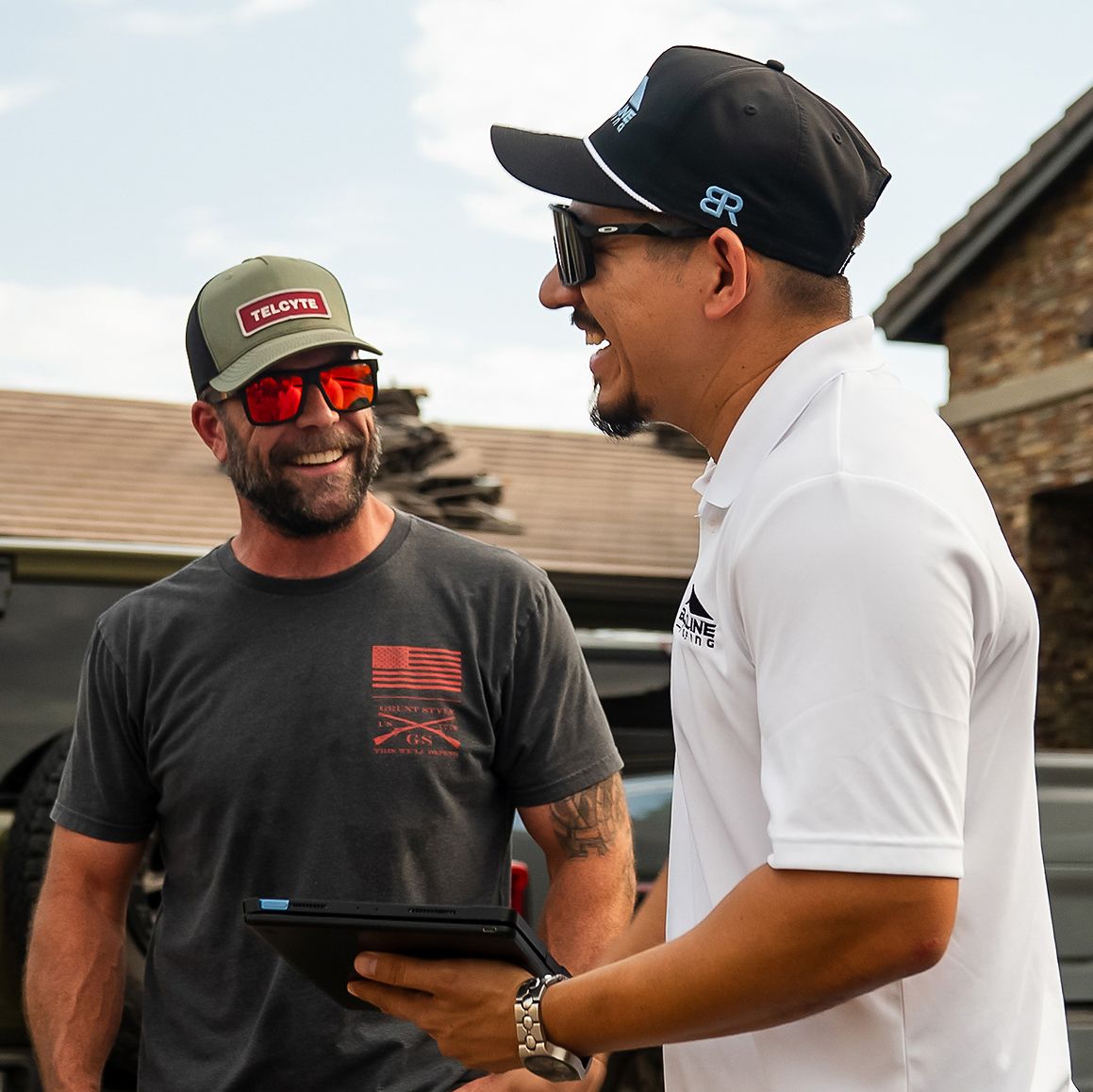 Blackline Roofing team laughing during a job walk