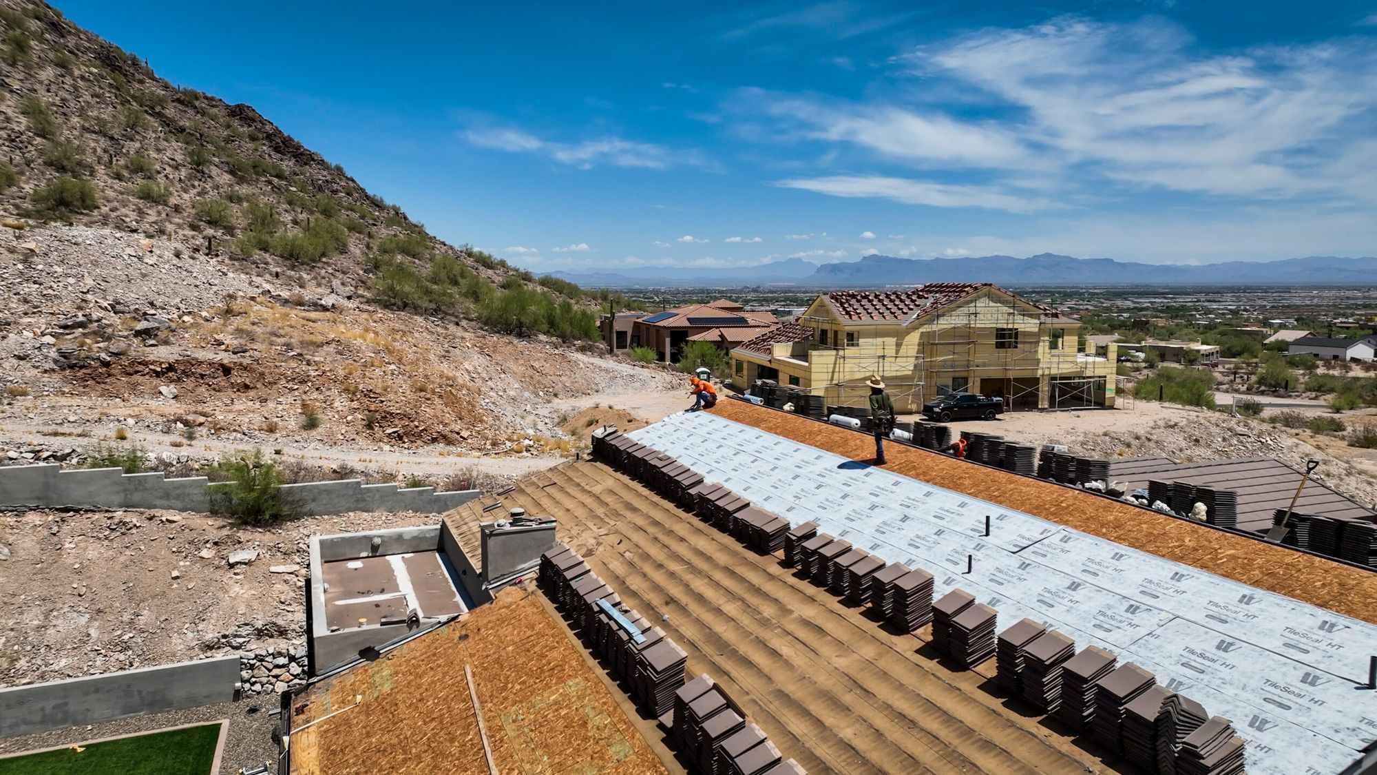 Blackline Roofing crew re-roofing a tile home in the Arizona desert