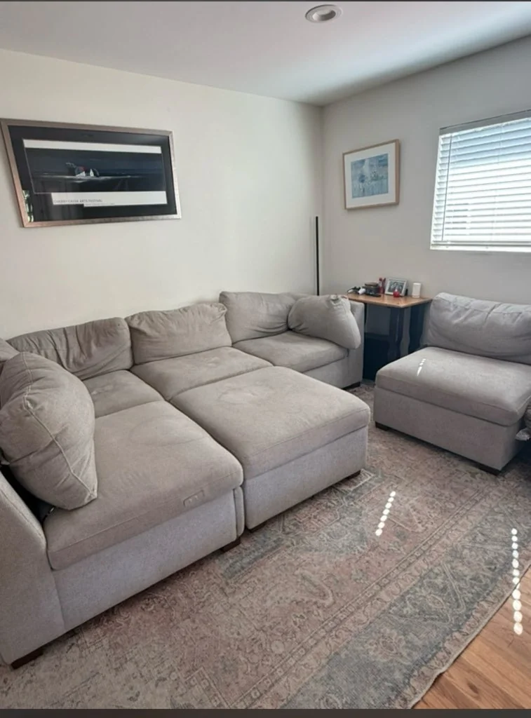 Gray sectional sofa inside a Clairemont Mesa home.