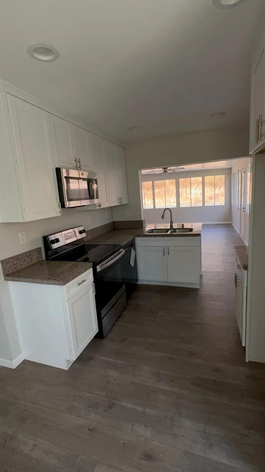 Kitchen with cleared counters and floor after a Chula Vista pre-sale property cleanout.