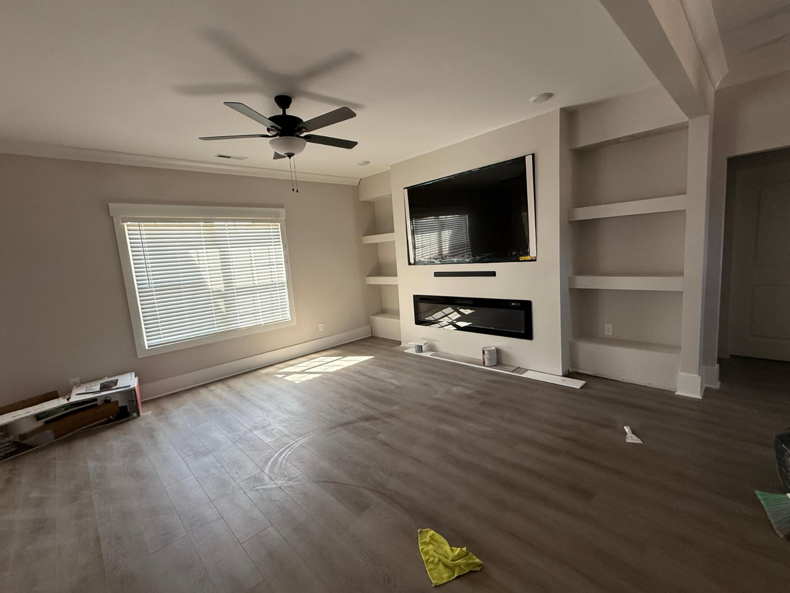 Custom built-ins, fireplace surround, and recessed entertainment shelving