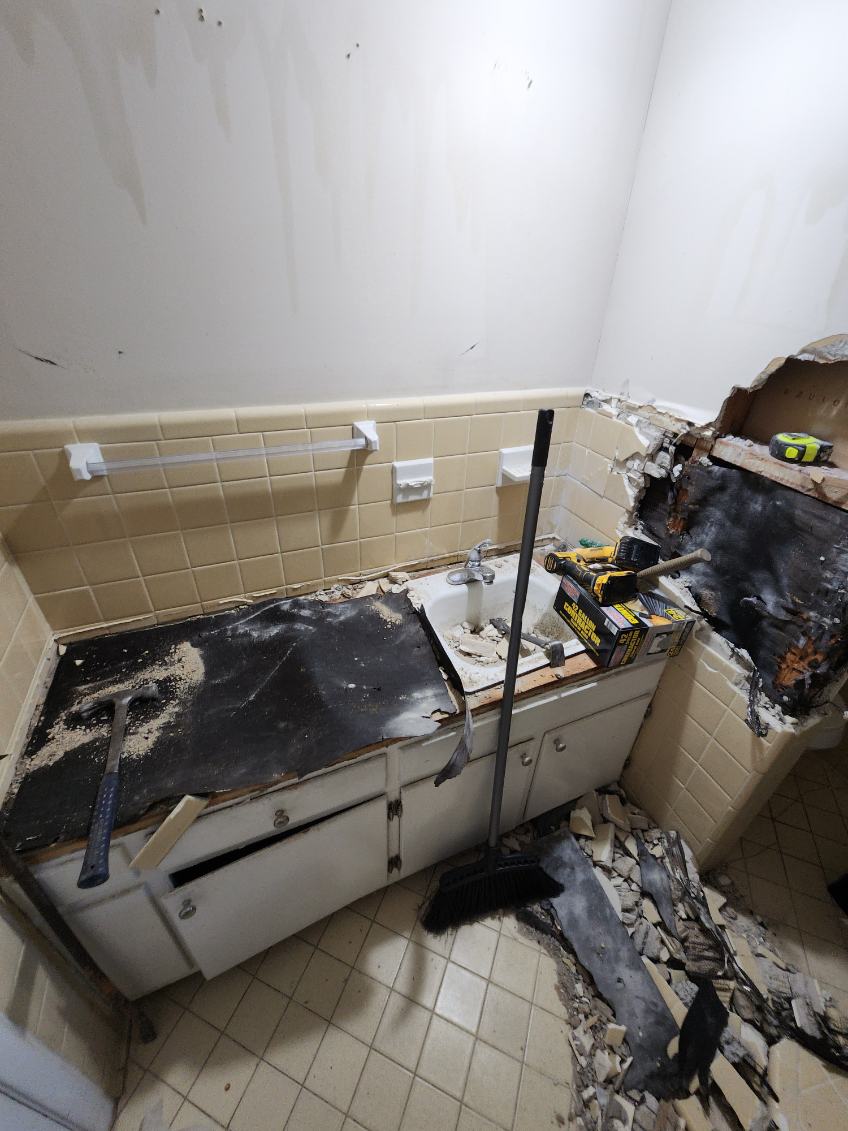 Controlled bathroom demolition, vanity and tile tear-out