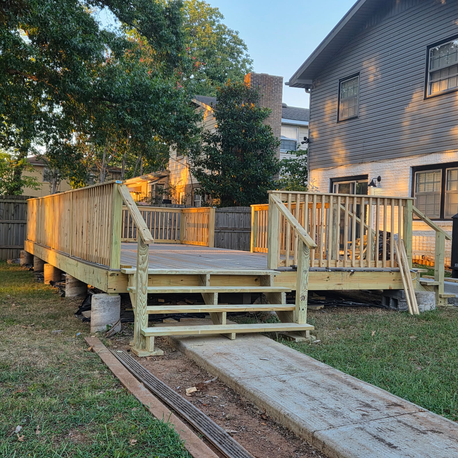 Custom outdoor deck with railings and entry stairs