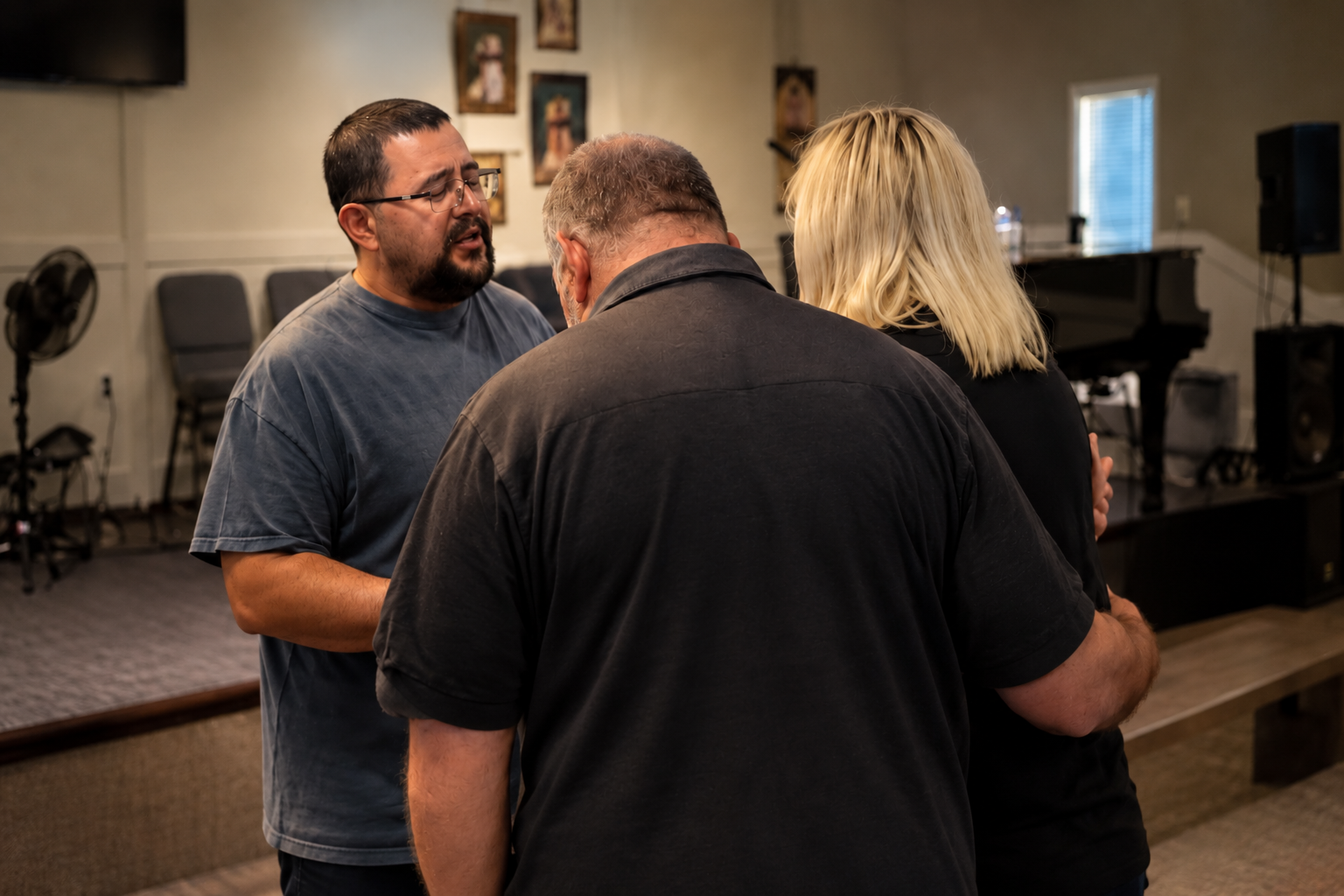 CrossFire Church members praying together and supporting one another in community