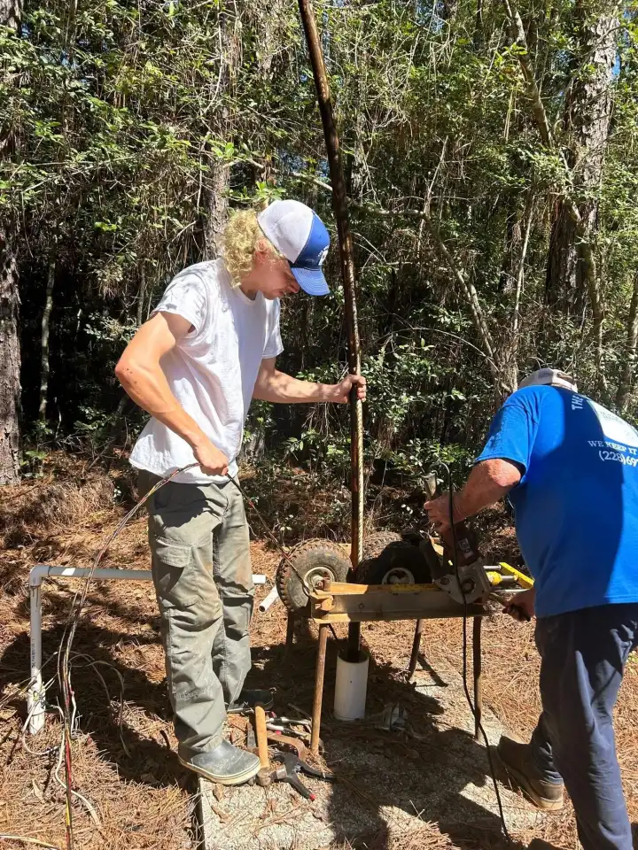 Father and son-in-law well team pulling and cutting pipe at customer well head
