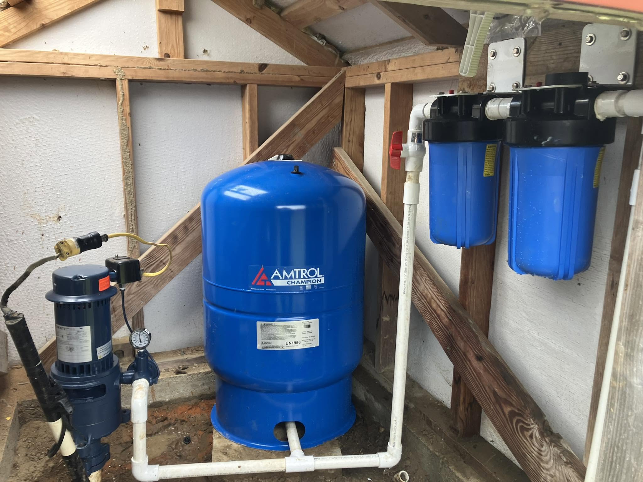 High quality well pump installation with Amtrol Champion pressure tank and dual blue filter system