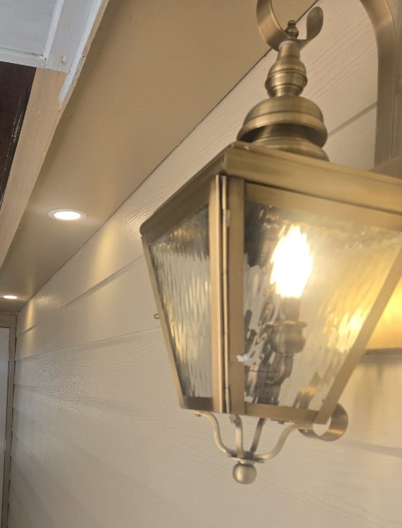 Brass exterior lantern and recessed soffit lights