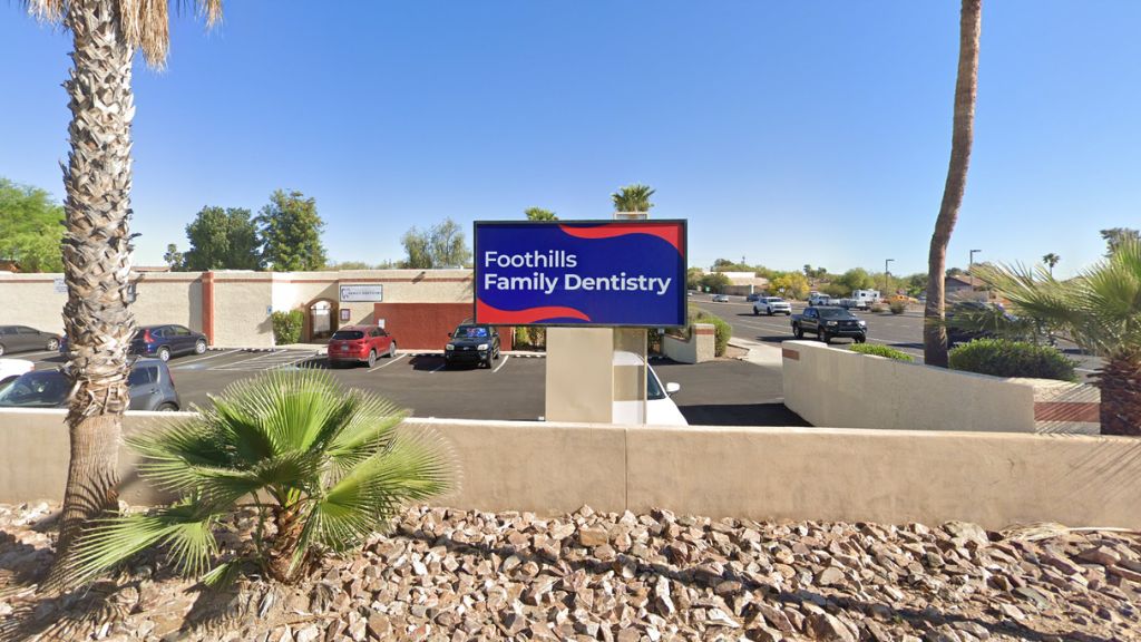 Foothills Family Dentistry street monument sign and parking lot on N Thornydale Road